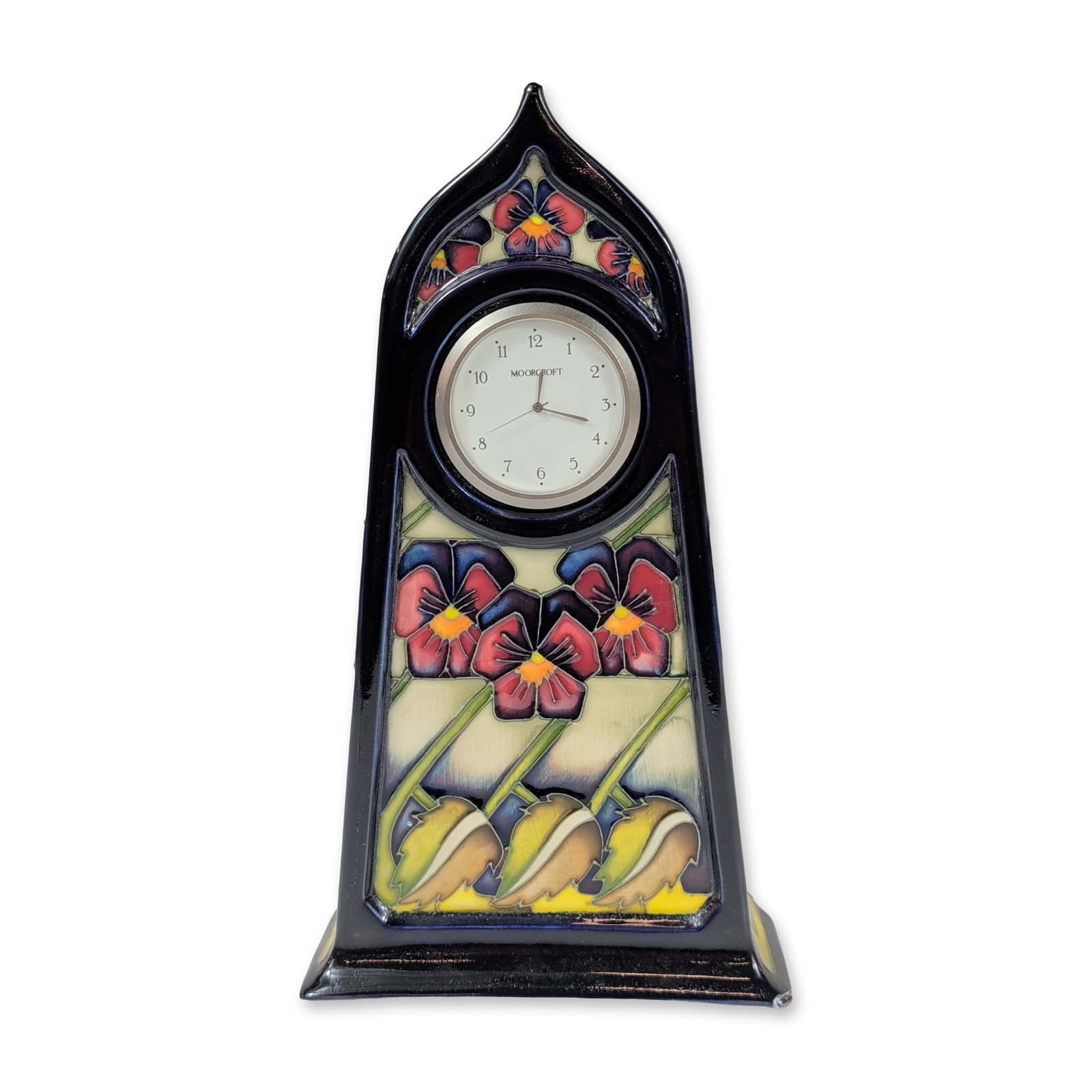 Moorcroft Dames Pansy Ceramic Mantel Clock: Moorcroft Pottery mantel clock in the Dames Pansy pattern designed by Kerry Goodwin. Glazed ceramic case with tube-lined decoration featuring pansy blossoms and buds in shades of claret, purple, blue,