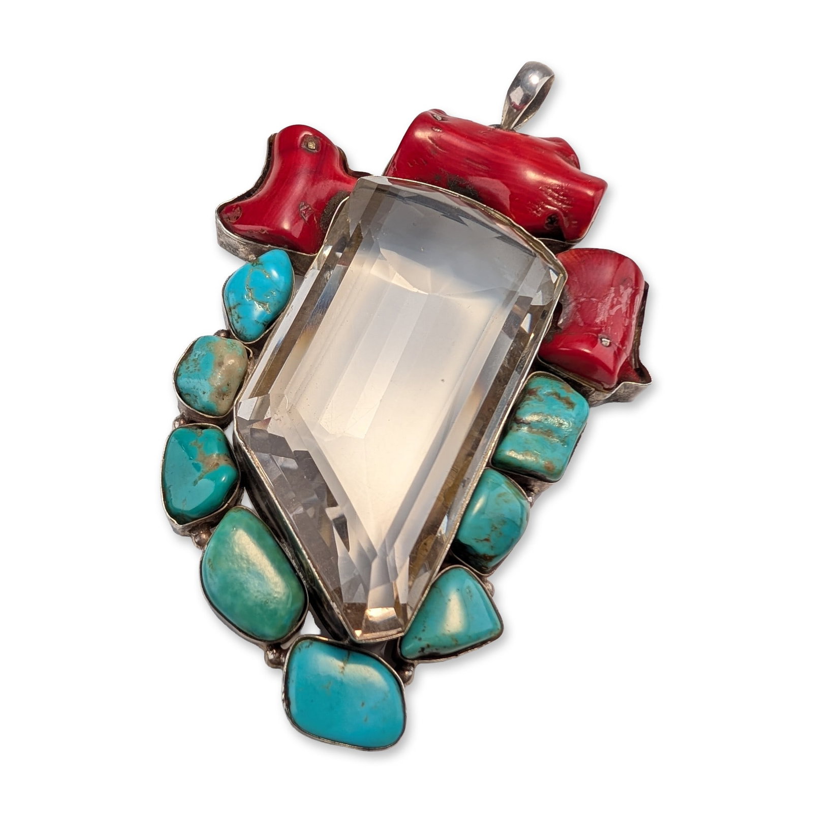 Large Sterling Silver with Turquoise and Coral Pendant: Sterling silver pendant featuring a large central multi-faceted clear stone. The design incorporates three pieces of natural red branch coral at the top and eight turquoise cabochons in varying blue a