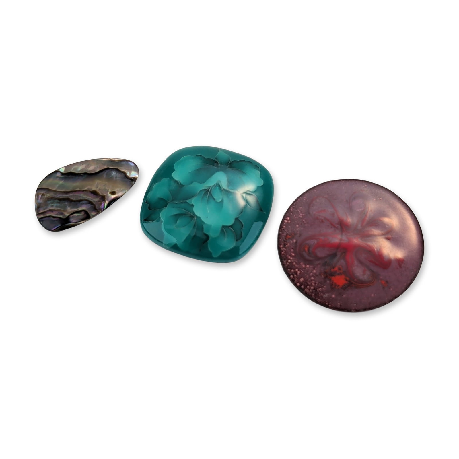 Three Gjedde Danish Enamel and Abalone Brooches: Set of seven Western-inspired button covers in sterling silver, featuring stamped geometric motifs. Each circular cover has a scalloped edge and a domed center, decorated with a concentric border of s