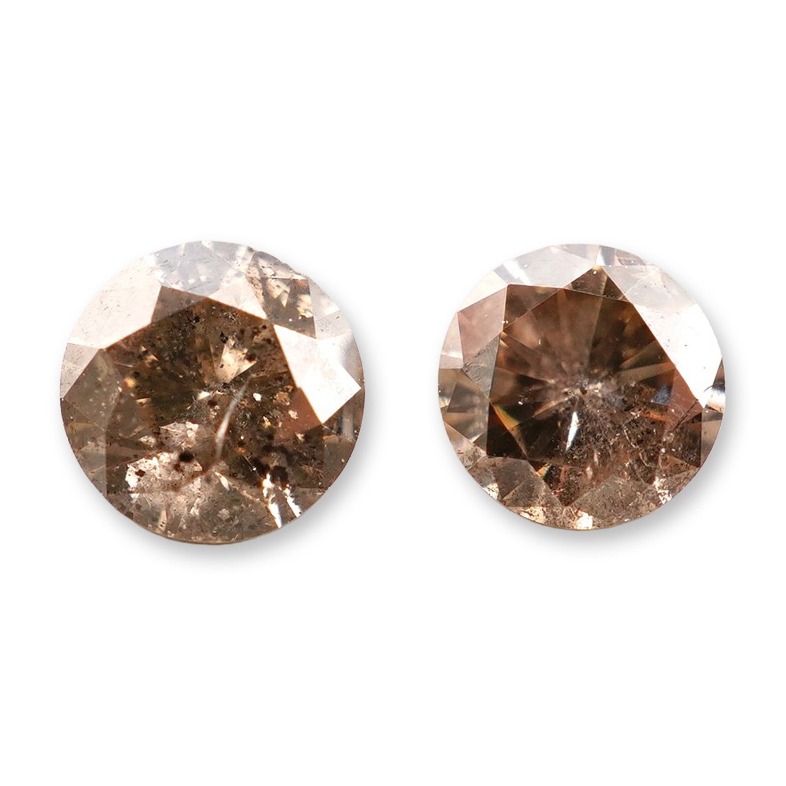 2pc 0.30ctw Champagne Diamonds: Stunning pair of champagne diamonds 0.15ct each totaling 0.30ctw. Come in a clear presentation box.