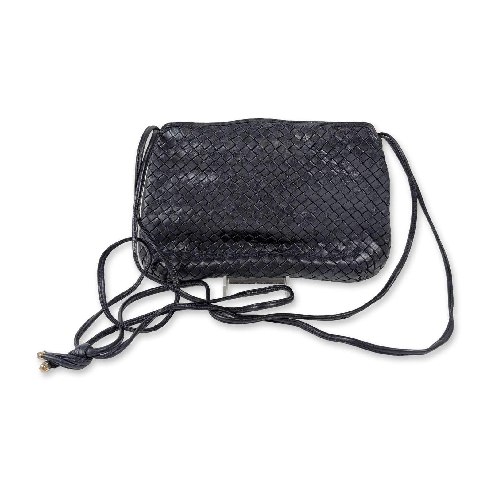 Charles Jourdan Black Woven Leather Crossbody Bag: Charles Jourdan vintage crossbody bag in black woven leather, featuring a rectangular pouch silhouette and magnetic snap closure. The shoulder strap is constructed of two leather cords with knotted ac
