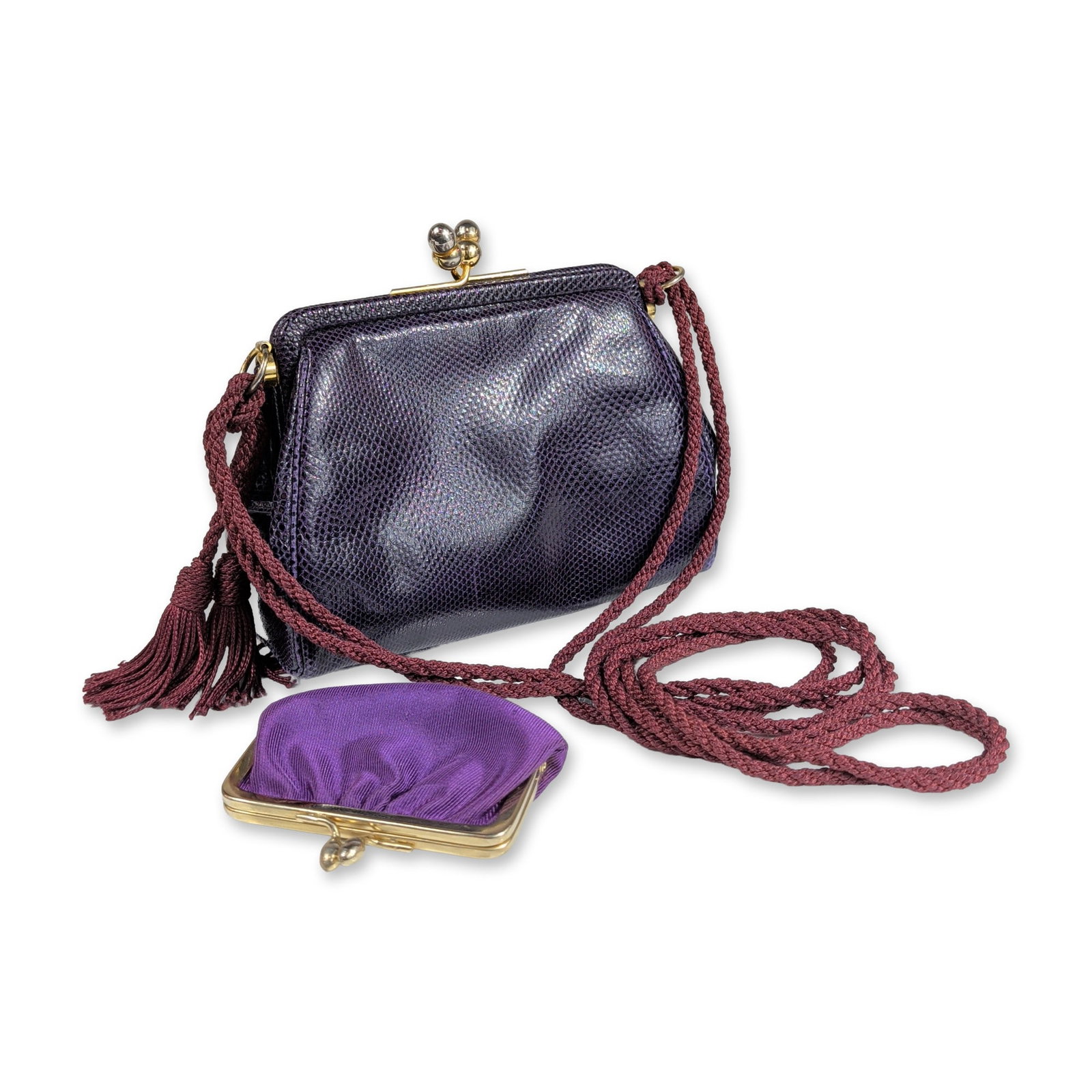 Judith Leiber Purple Karung Lizard Shoulder Bag: Vintage Judith Leiber. Frame evening bag in purple Karung reptile skin, featuring a gold-tone metal frame with two-bead kiss-lock closure and a coordinating braided cord shoulder strap with tassels. T