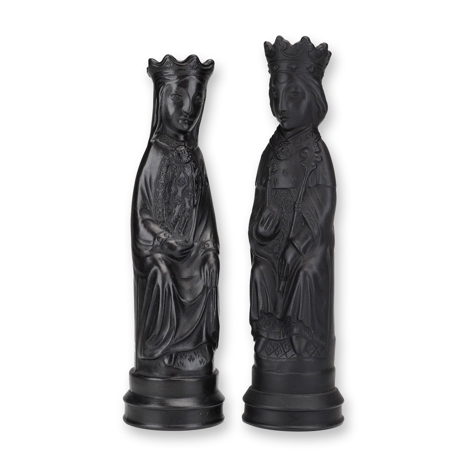 A Pair of Wedgwood Black Basalt King and Queen Chess Pieces by Arnold Machin: This pair of Wedgwood black basalt figurines, representing a King and a Queen, was designed by the artist Arnold Machin. The figurines are rendered in a stylized medieval Gothic manner. The King figur