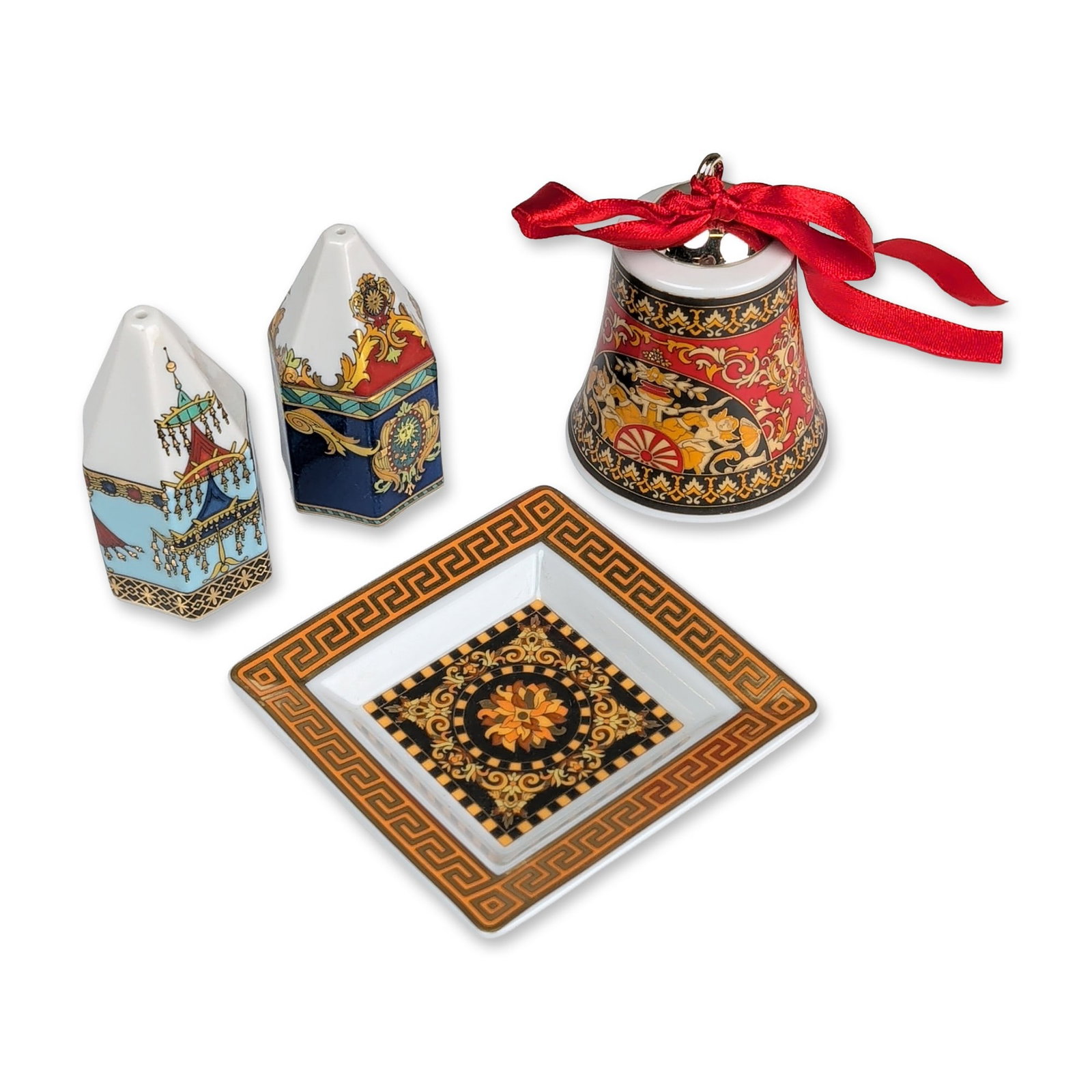 Set of Four Rosenthal Versace Porcelain Collection - Dish, Shakers & Bell: Collection of four Rosenthal porcelain items from collaborations with Versace. The group includes a year 2000 Christmas bell decorated with classical figures in a chariot against a red ground; a squar