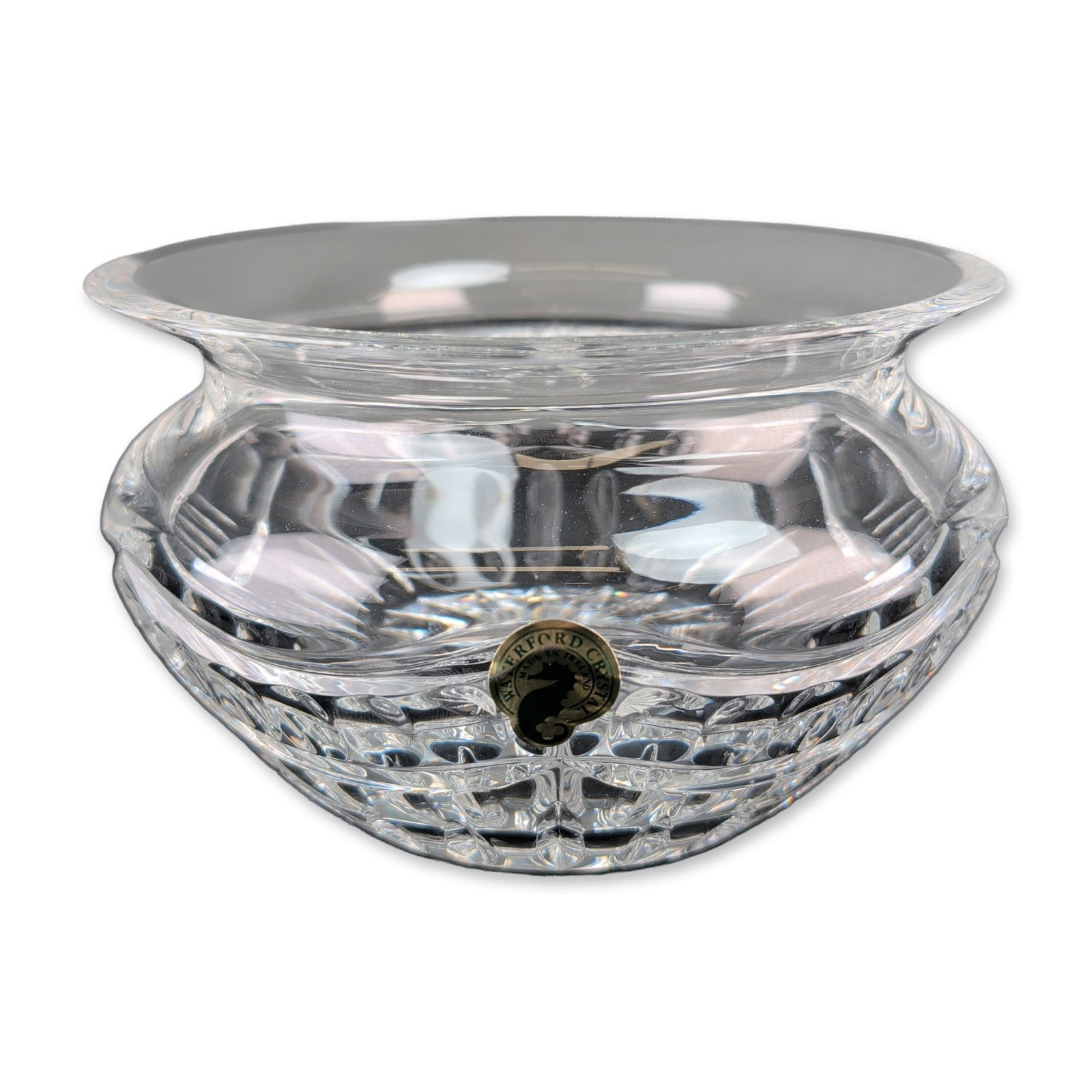 Waterford Pompeii Crystal Footed Bowl: Waterford Crystal. Pompeii pattern footed bowl in hand-cut lead crystal, featuring vertical wedge cuts at the rim and a field of diamond cuts at the base. Underside displays an acid-etched seahorse ma