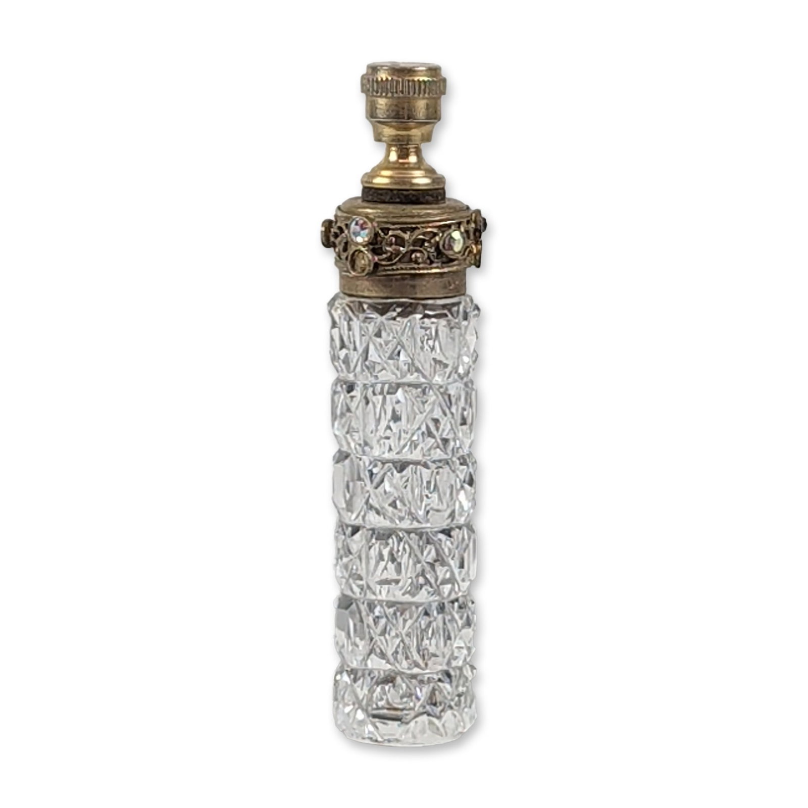Czechoslovakian Cut Glass Jeweled Miniature Scent Bottle: Czechoslovakian miniature scent bottle featuring a cut crystal cylindrical body with diamond-point and cross-hatched patterns. The vessel is mounted with a gilt-tone filigree metal collar inset with f