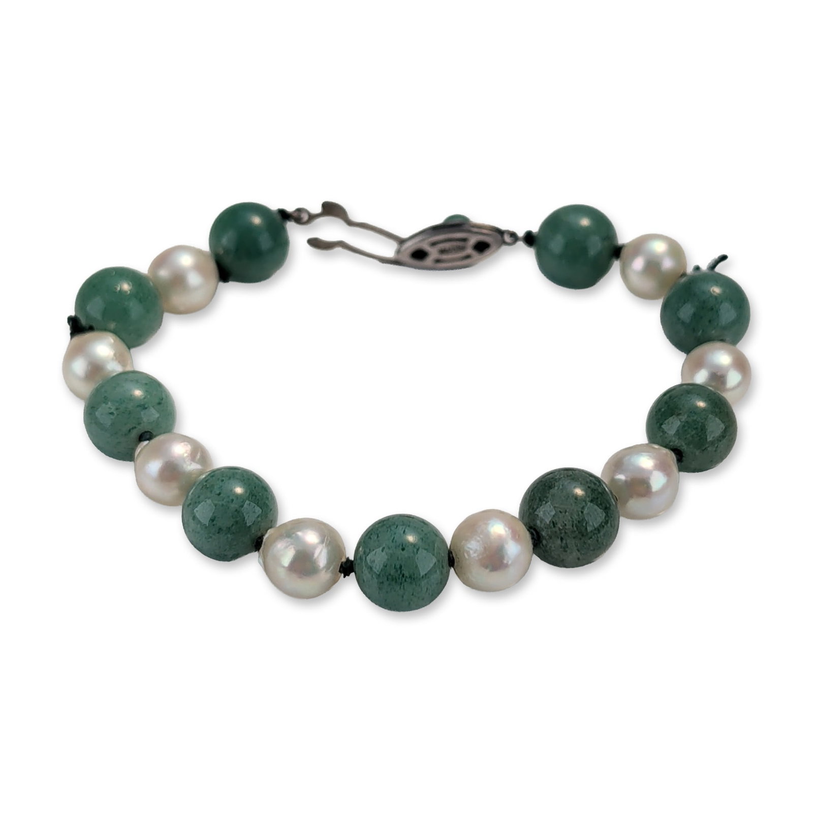 Green Stone and Cultured Pearl Bracelet with Sterling Silver Clasp: Navajo Western Americana cuff bracelet in sterling silver, featuring three-dimensional high-relief motifs including a central cowboy hat with a twisted rope hatband, a cowboy boot, and a coiled lasso.