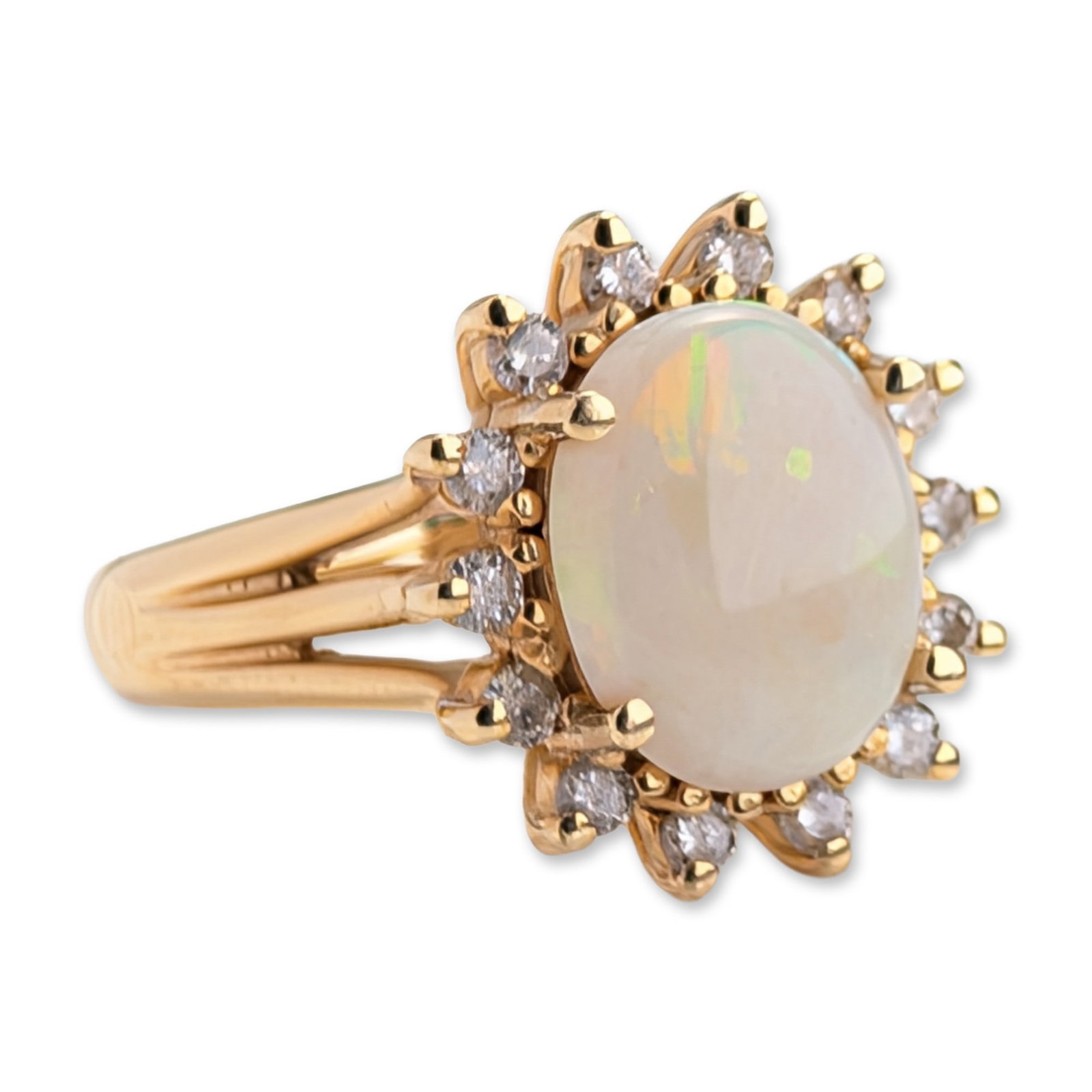 EMA 14K Yellow Gold Opal and Diamond Sunburst Ring: EMA Jewelry 14 karat yellow gold cluster ring. The design features a centrally set oval cabochon opal with a milky-white body color and visible green, orange, and yellow play-of-color. The opal is sur