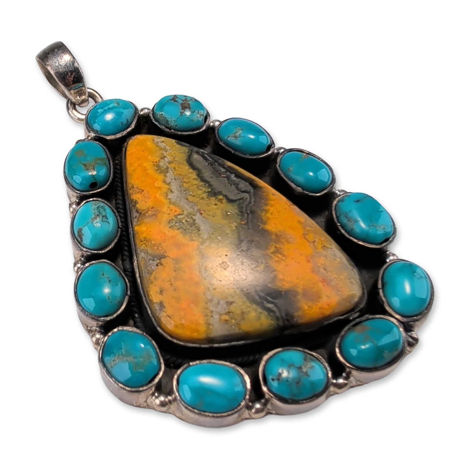 Southwestern Sterling Silver Bumblebee Jasper and Turquoise Pendant: Sterling silver pendant featuring a stylized bow with incised linear texture and central knot, from which a three-dimensional puffy heart is suspended. The piece is constructed with a fixed loop and t