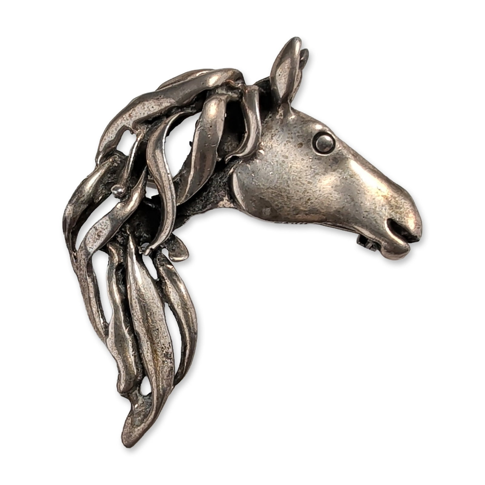 Sterling Silver Horse Head Brooch: Sterling silver brooch and pendant combination designed as a stylized horse head in profile. The sculptural piece features an open mouth and a dynamic openwork mane composed of overlapping, curved str