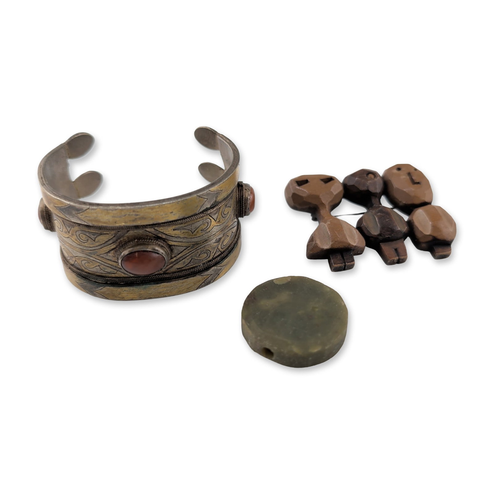 3pc Middle Eastern Style Jewelry Items: A loose heart-shaped faceted gemstone stated to be green amethyst. The stone exhibits a pale mint green hue and transparent clarity. The heart shape features brilliant-style faceting designed to showc