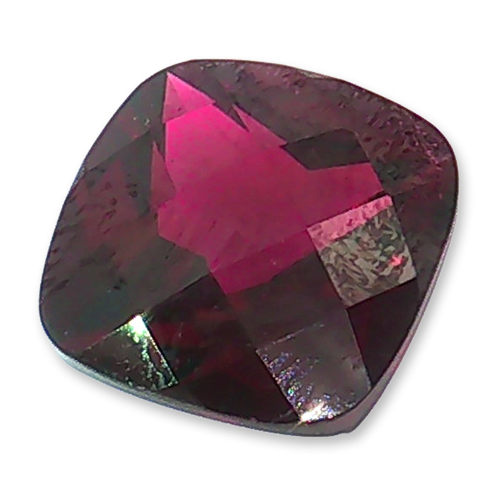 Cushion Cut Rhodolite Garnet: Loose labradorite gemstone featuring a classic cushion cut with a brilliant-style crown and a modified pavilion. The stone exhibits a warm peachy-pink hue and high transparency. The faceted surface is