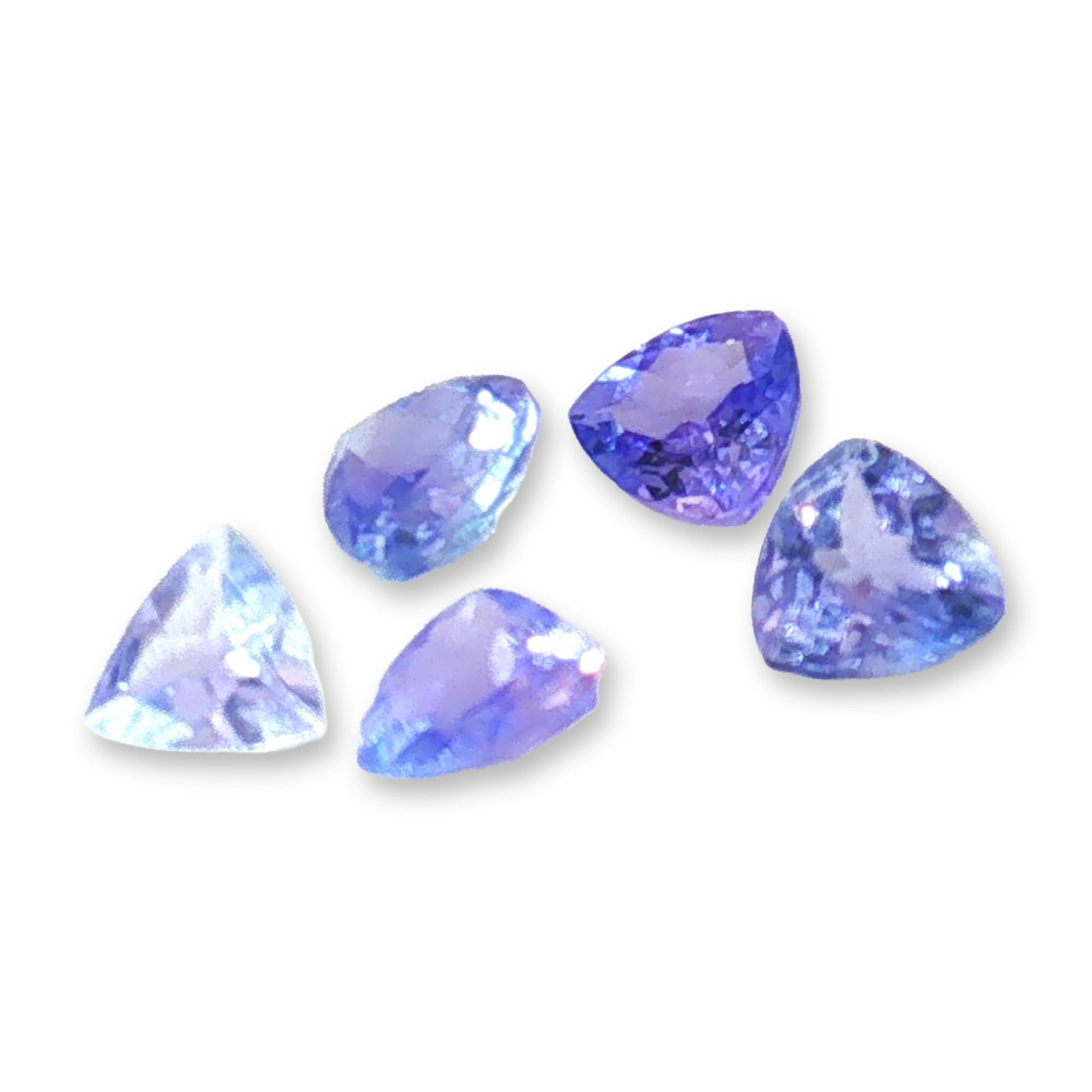 5pc Violet Blue Tanzanite Stones: Striking 5pc grouping of tanzanite stones. Violet-blue tanzanite is renowned for its striking color and spiritual properties. It is highly sought after for jewelry, celebrated as a December