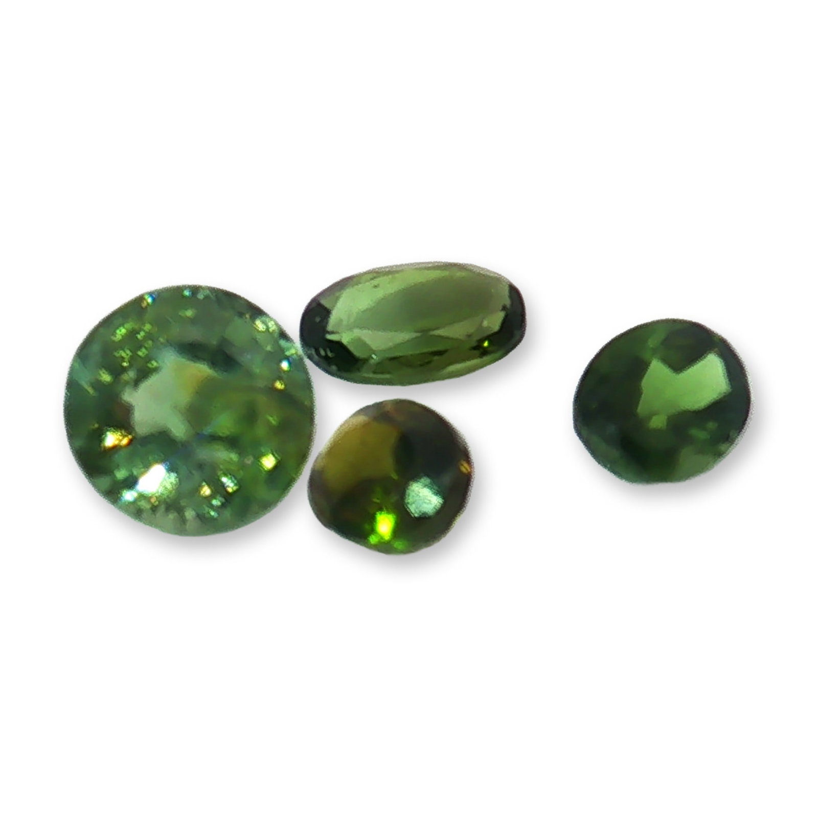 4pc Olive Green Tourmaline Stones: Beautiful set of 4 oval and round olive green tourmaline stones. Tourmaline is a versatile, colorful gemstone celebrated for grounding, psychic protection, and emotional healing. It is widely used in
