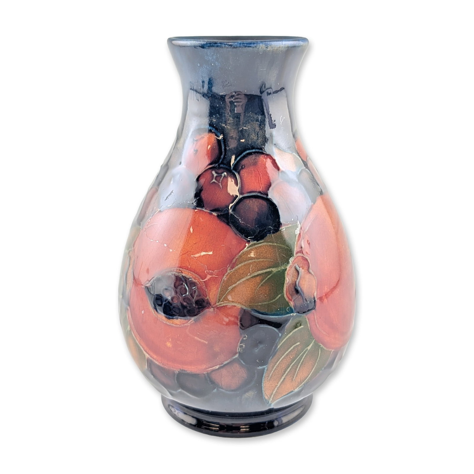 Moorcroft English Art Pottery Pomegranate Ceramic Vase: Early 20th-century English art pottery vase by Moorcroft in the "Pomegranate" pattern. The small oviform ceramic vessel features a flared rim and low pedestal base, decorated with tubelined pomegranat