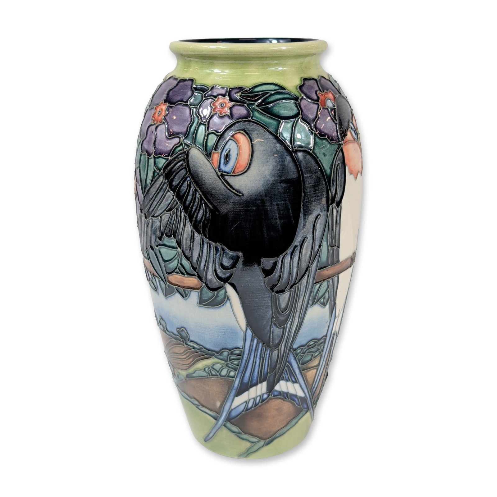 Moorcroft Rachel Bishop Swallows Earthenware Vase: Moorcroft tubelined earthenware vase in the Swallows pattern, designed by Rachel Bishop, circa 1997. The ovoid body features a limited edition design depicting swallows in flight and perched among sty