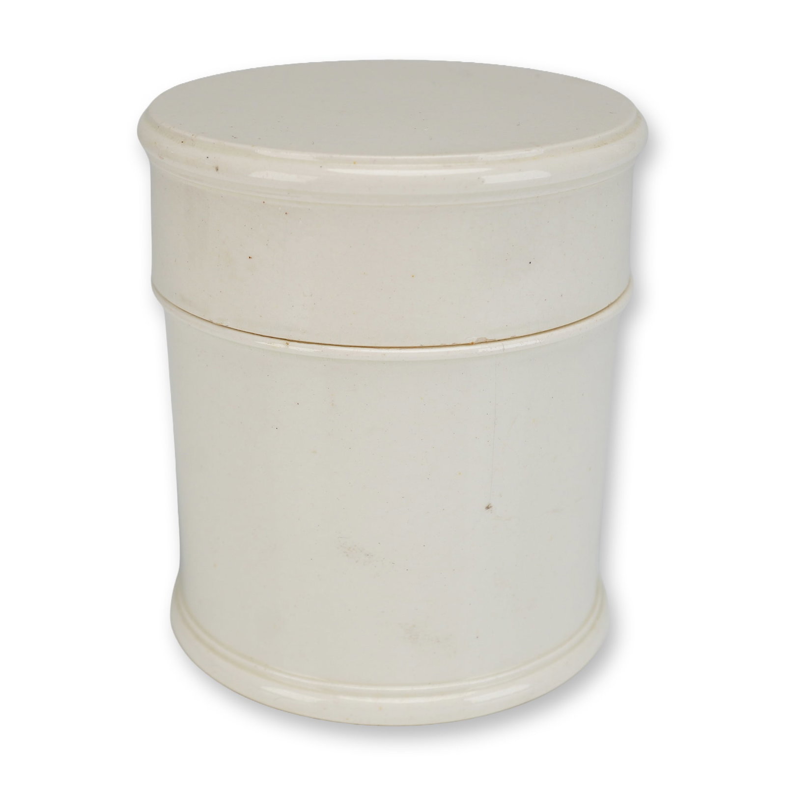 Wedgwood Creamware Eggbeater and Lid: This Wedgwood creamware eggbeater consists of a cylindrical body with a matching cover. The vessel features a molded stepped base and a slightly flared rim to accommodate the flanged lid. The interior