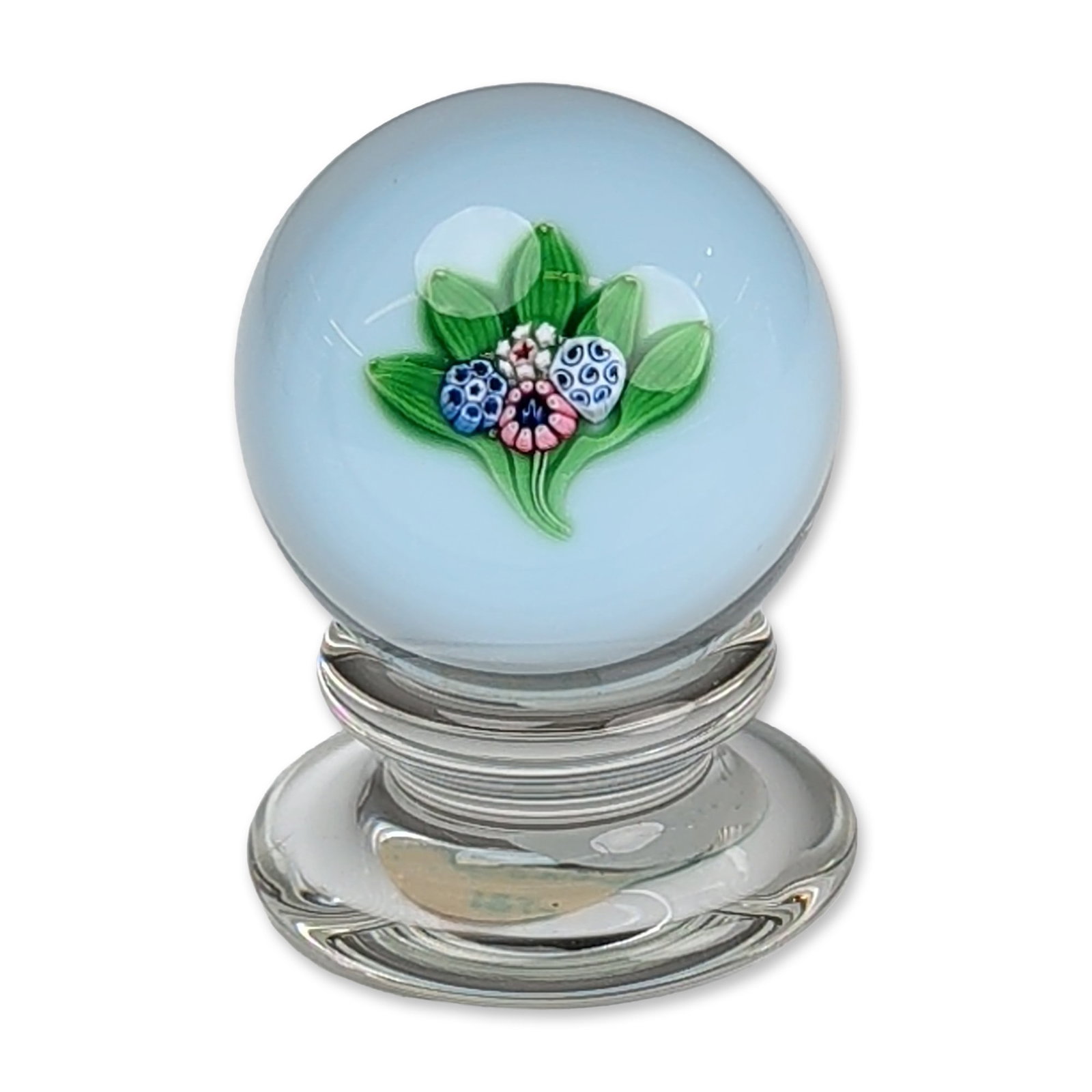 Francis D. Whittemore Millefiori Pedestal Art Glass Paperweight: Hugh Edmund Smith (American, 20th century). Art glass paperweight featuring lampwork botanical elements including three brown cattails and eight slender green fronds. The spray is set into a textured 