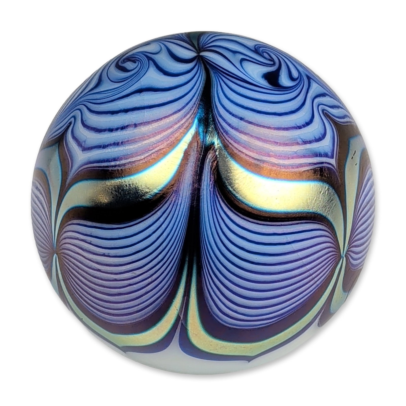 Steven Correia Iridescent Pulled Feather Art Glass Paperweight: Steven Correia (American, b. 1948). Spherical paperweight in iridescent glass, featuring a pulled peacock feather motif in shades of cobalt and light blue over an opaque white ground. The surface is f