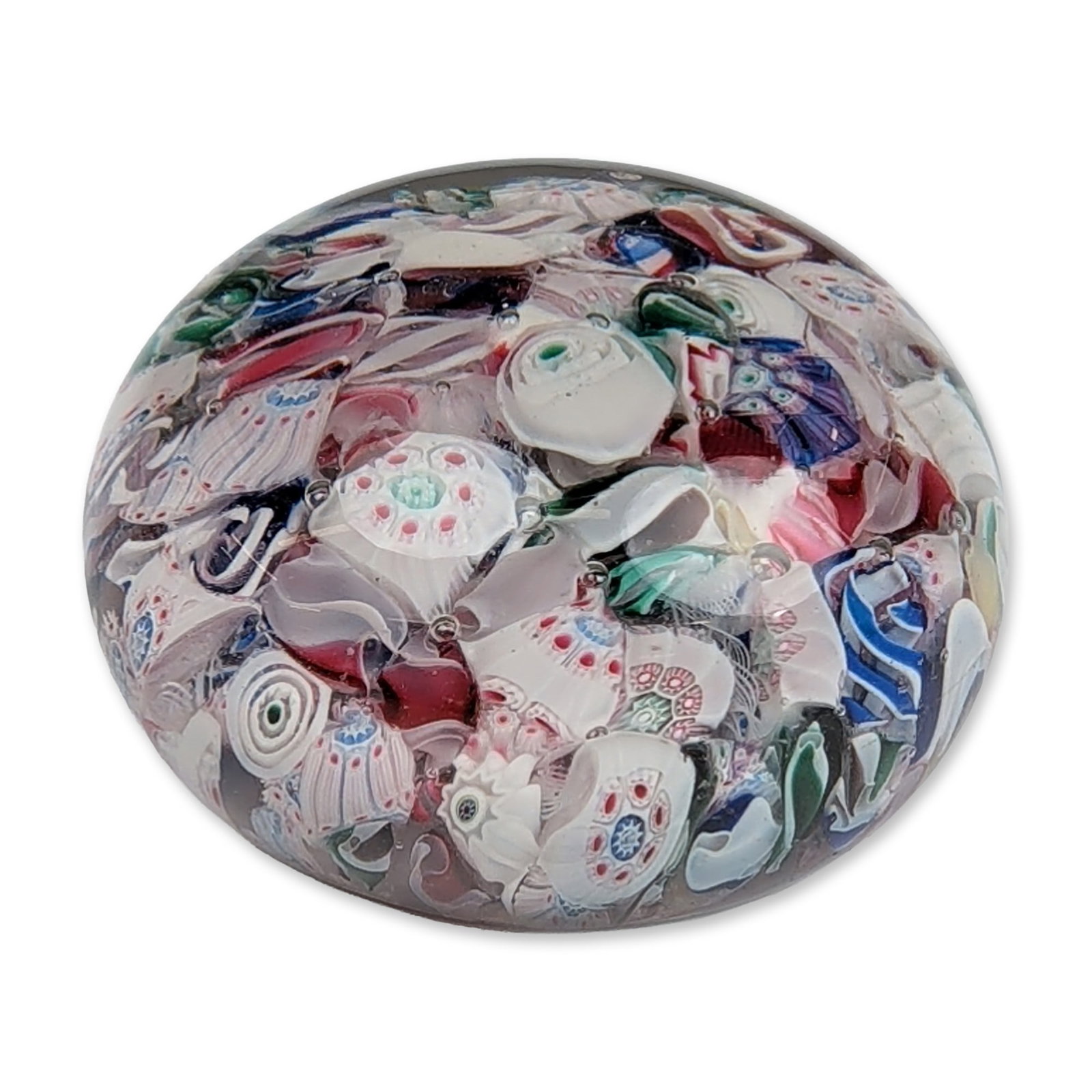 William T. Gillinder Scrambled Millefiori Glass Paperweight: Scrambled millefiori glass paperweight by William T. Gillinder and Sons (1861 - 1871). The internal motif consists of a dense arrangement of polychrome glass fragments, including complex millefiori
