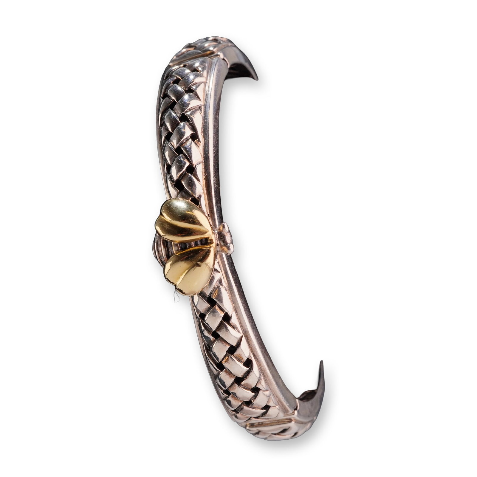 Saint by Sarah Jane Sterling Silver and 18K Gold Woven Bangle Bracelet: A designer hinged bangle bracelet by Saint by Sarah Jane. This piece is crafted from .925 sterling silver and features a prominent woven or braided texture across the exterior. The center of the band 