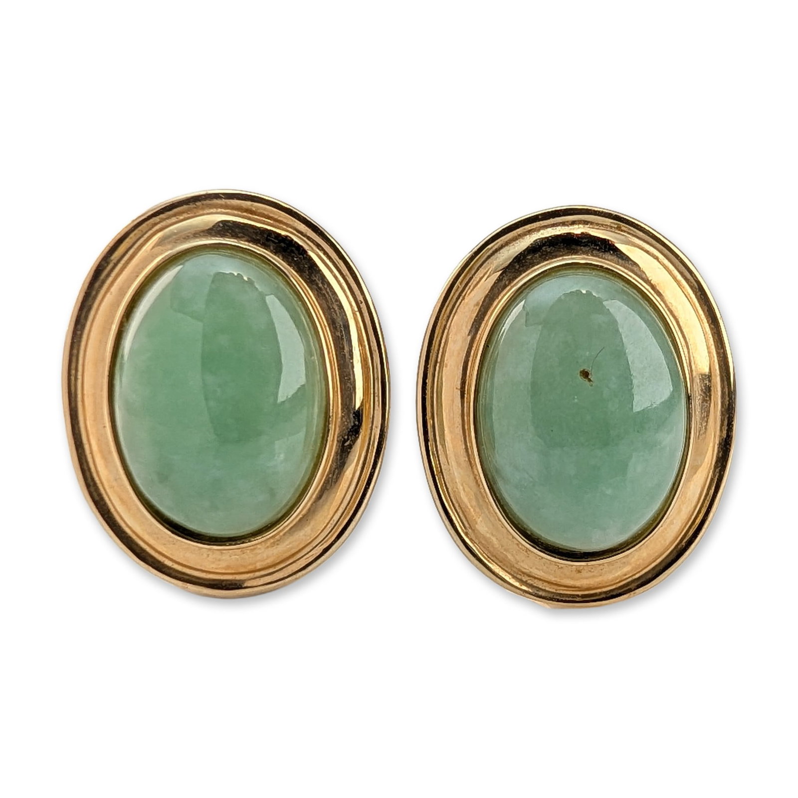 14K Yellow Gold Jade Cabochon Earrings: Pair of estate earrings in 14k yellow gold, each featuring a bezel-set oval green mottled jade cabochon within a stepped frame. Equipped with post and hinged omega back closures. Hallmarked 585, 14K, 