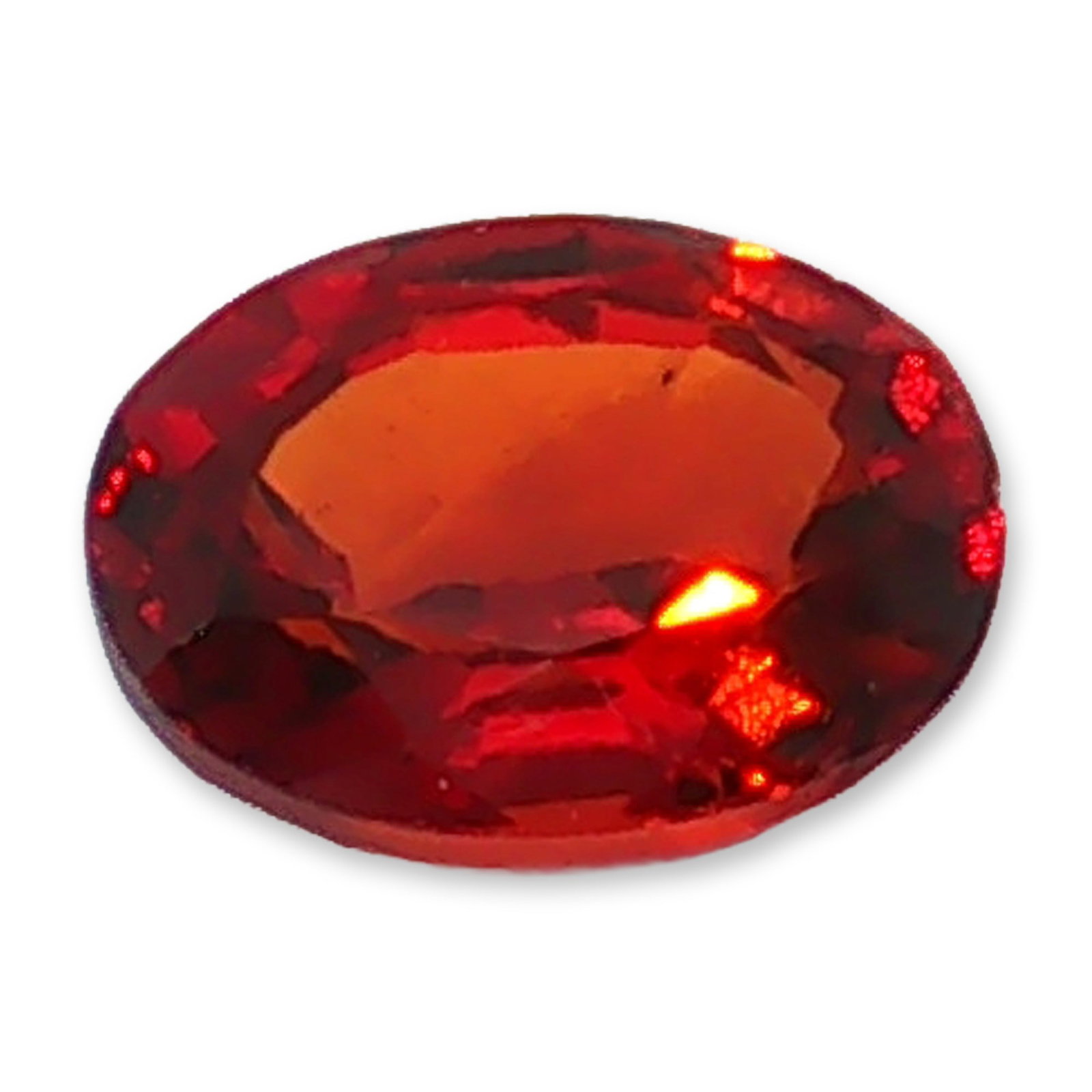 Oval Cut Hessonite Garnet: Loose faceted gemstone in labradorite, featuring an emerald cut with clipped corners. The stone exhibits a saturated orange to reddish-orange hue. Internal crystalline inclusions and veining are visib