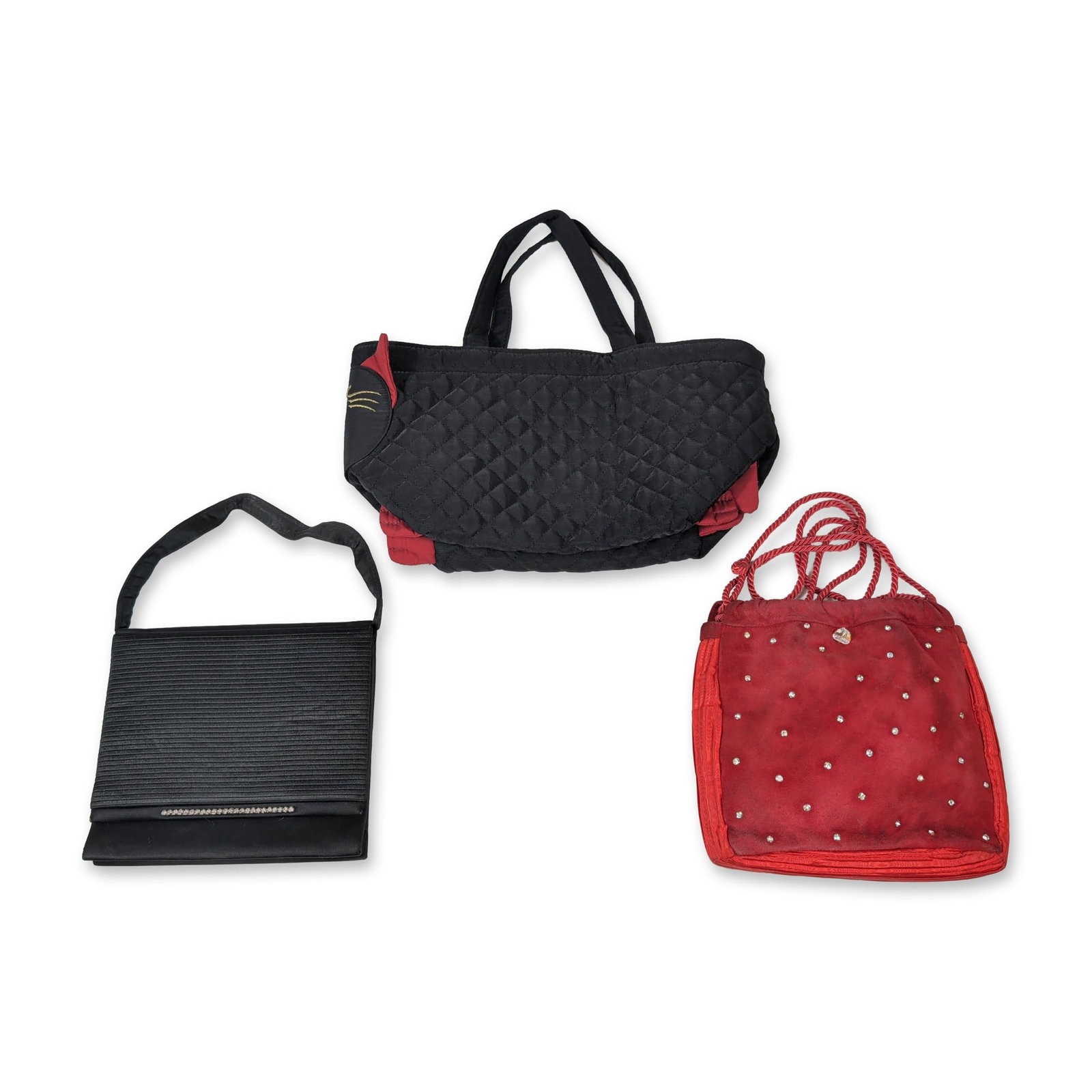 Trio of Vintage Evening Bags: Structured rectangular evening clutch in black satin, featuring a pleated front panel accented with a single row of channel-set clear rhinestones along the bottom edge. The interior is fitted with a s