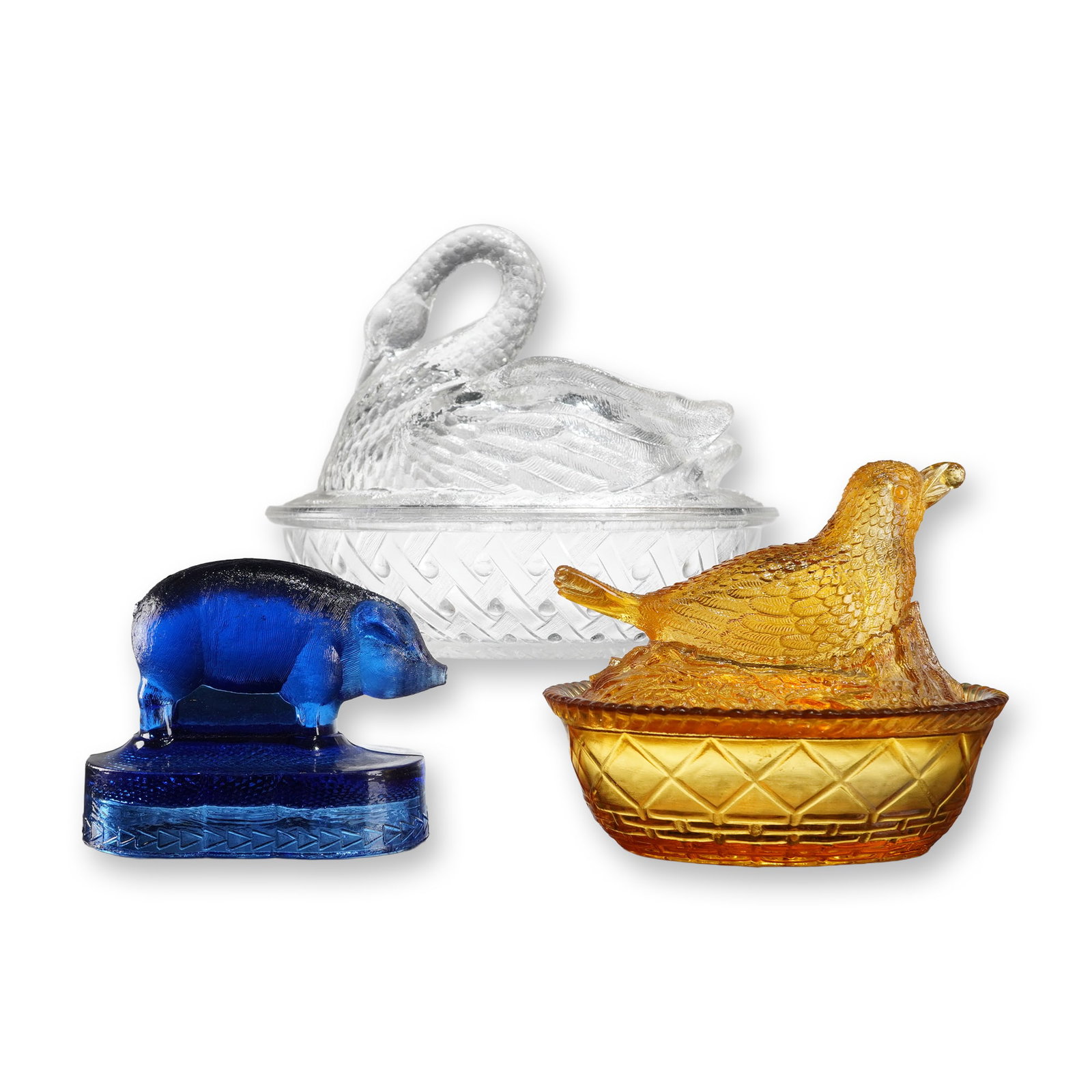 3 EAPG Figural Glasses Robin & Swan on Nest + Bellaire Pig Paperweight: This lot comprises of Early American Pattern Glass (EAPG) figural objects. The first item is a two-piece covered dish, often attributed as a Boy Glass Robin on Nest Honeycomb covered dish. It is rende
