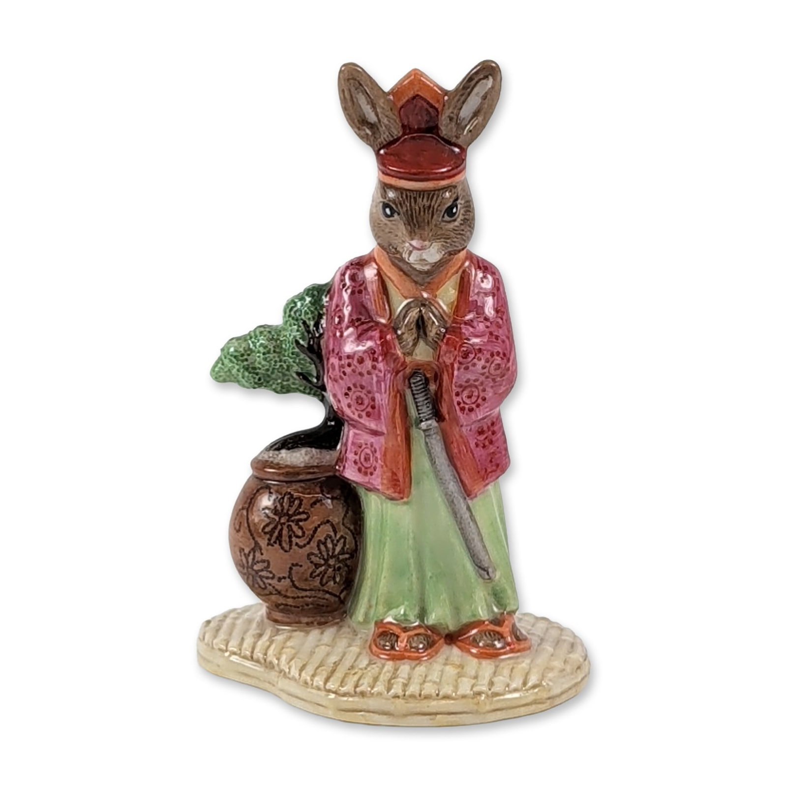 Royal Doulton Samurai Bunnykins DB 280 A 2 Rare Color Variation Limited Edition: Royal Doulton Samurai Bunnykins figurine in hand-decorated glazed porcelain, featuring an anthropomorphic rabbit character dressed in a rare color variation patterned pinkish-maroon jacket, green plea