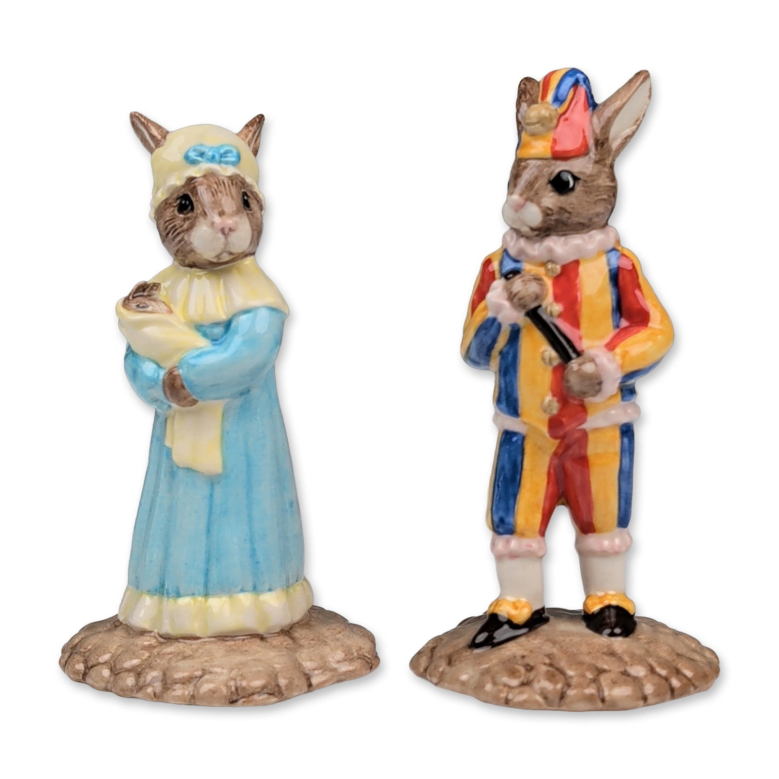 2pc Royal Doulton Punch and Judy Bunnykins Figurines: Royal Doulton. A pair of hand-decorated ceramic figurines from the Bunnykins Punch and Judy Collection. Included are Mr. Punch Bunnykins (DB 234), depicted in a red, yellow, and blue striped costume w