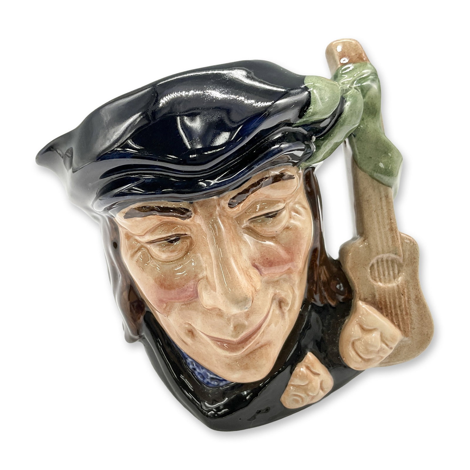 Scaramouche D6561 - Small - Royal Doulton Character Jug: Style One. Blue-black, brown, and green coloration. Royal Doulton backstamp. Artist: Max Henk Dimensions: 3.25"H Date or Era: 1962 - 1967 Manufacturer or Brand: Royal Doulton Country of Origin: <