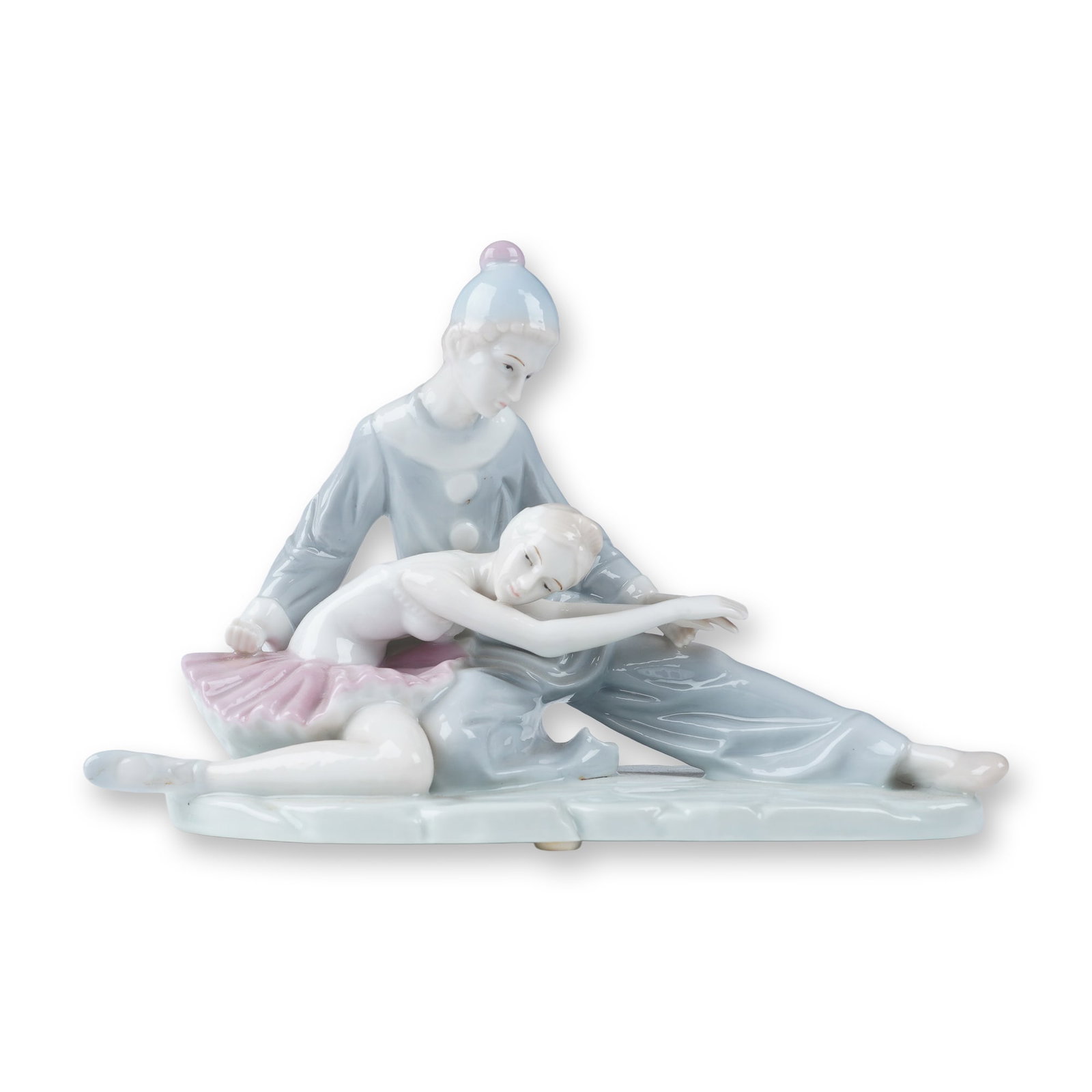 KPM Arnart Porcelain Figurine, Pierrot and Ballerina: Beautiful porcelain figurine depicting a tender moment between a ballerina and Pierrot, a classic pantomime character. The delicate composition captures the ballerina resting against Pierrot, showcasi