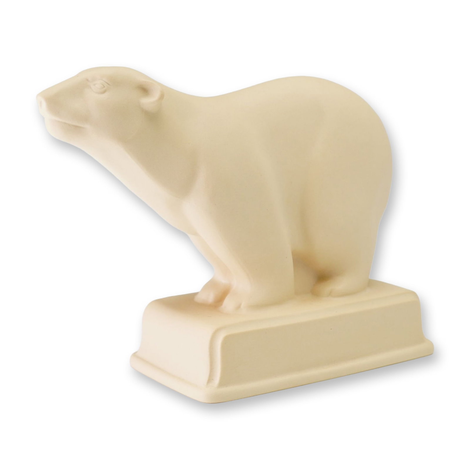 Wedgwood The Barlaston Collection Cream Polar Bear Figurine after John Skeaping: This cream-colored ceramic figurine depicts a stylized polar bear standing on an integral rectangular pedestal base. The piece is part of The Barlaston Collection and was produced as an exclusive for 
