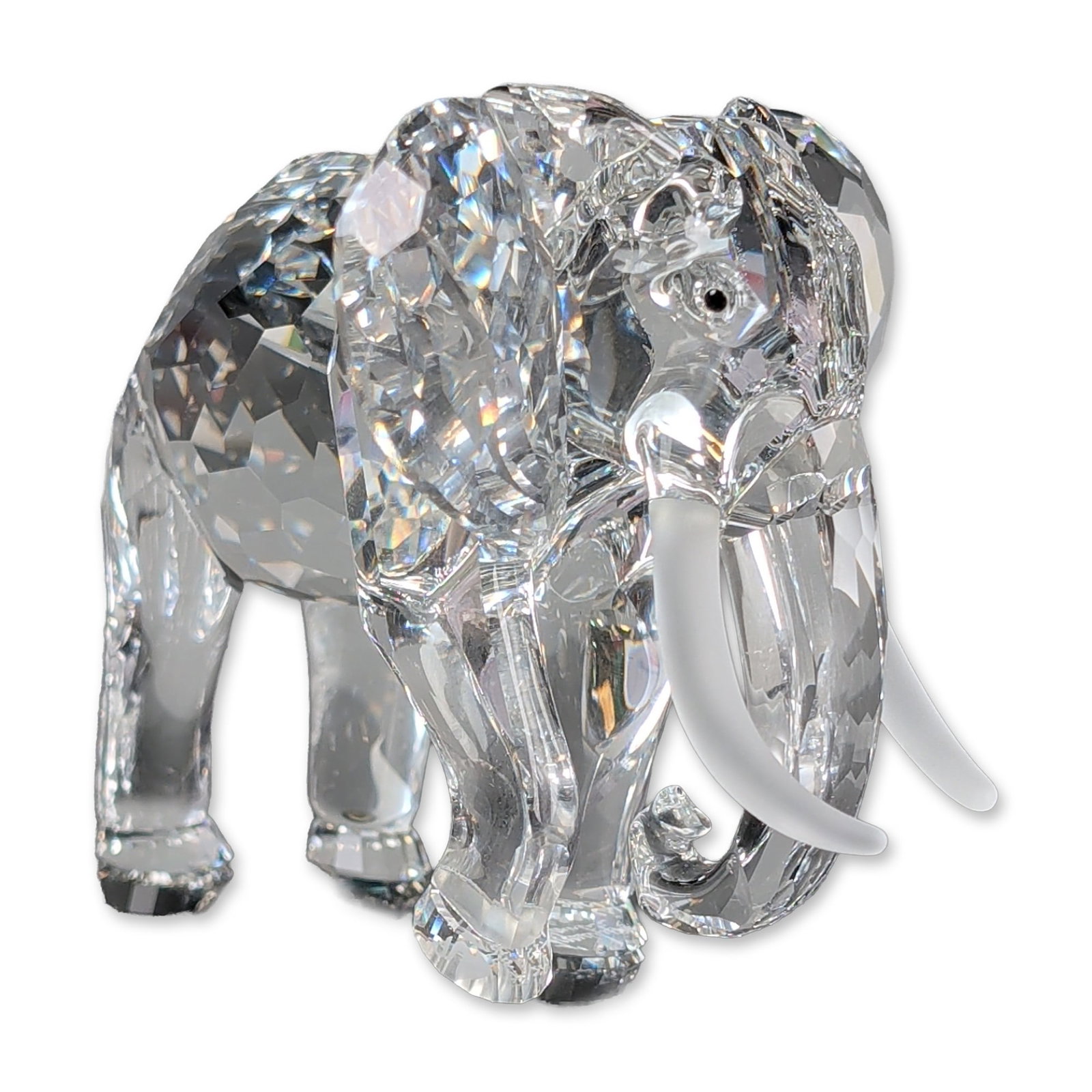 Swarovski Crystal 1993 SCS Annual Edition Figurine, African Elephant: Swarovski 1993 SCS Annual Edition crystal figurine from the Inspiration Africa series. The piece is constructed of faceted clear lead crystal with frosted crystal tusks and two inset black crystal