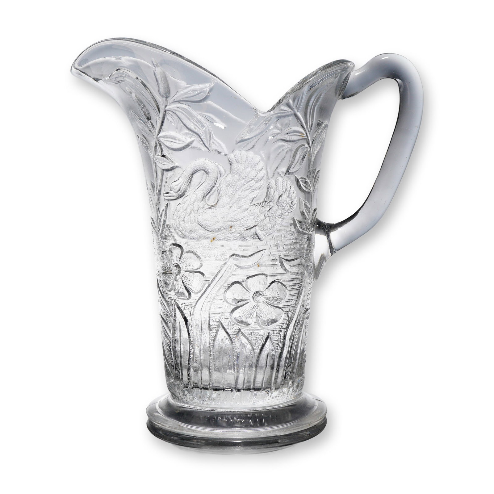 Early American Pattern Glass EAPG Swan and Flowers Pitcher: A single Early American Pattern Glass (EAPG) pitcher, identified as the "Swan and Flowers" pattern. This pattern was introduced circa 1905. The vessel is constructed of clear pressed glass and