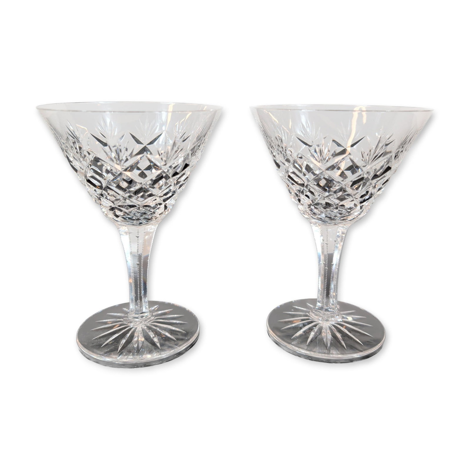 Pair of Crystal Wine Glasses: Pair of wine glasses, featuring lead crystal construction with a band of diamond-cut cross-hatching and vertical wedge-cut fans. Each glass includes a multi-faceted stem with a central knop and a circ