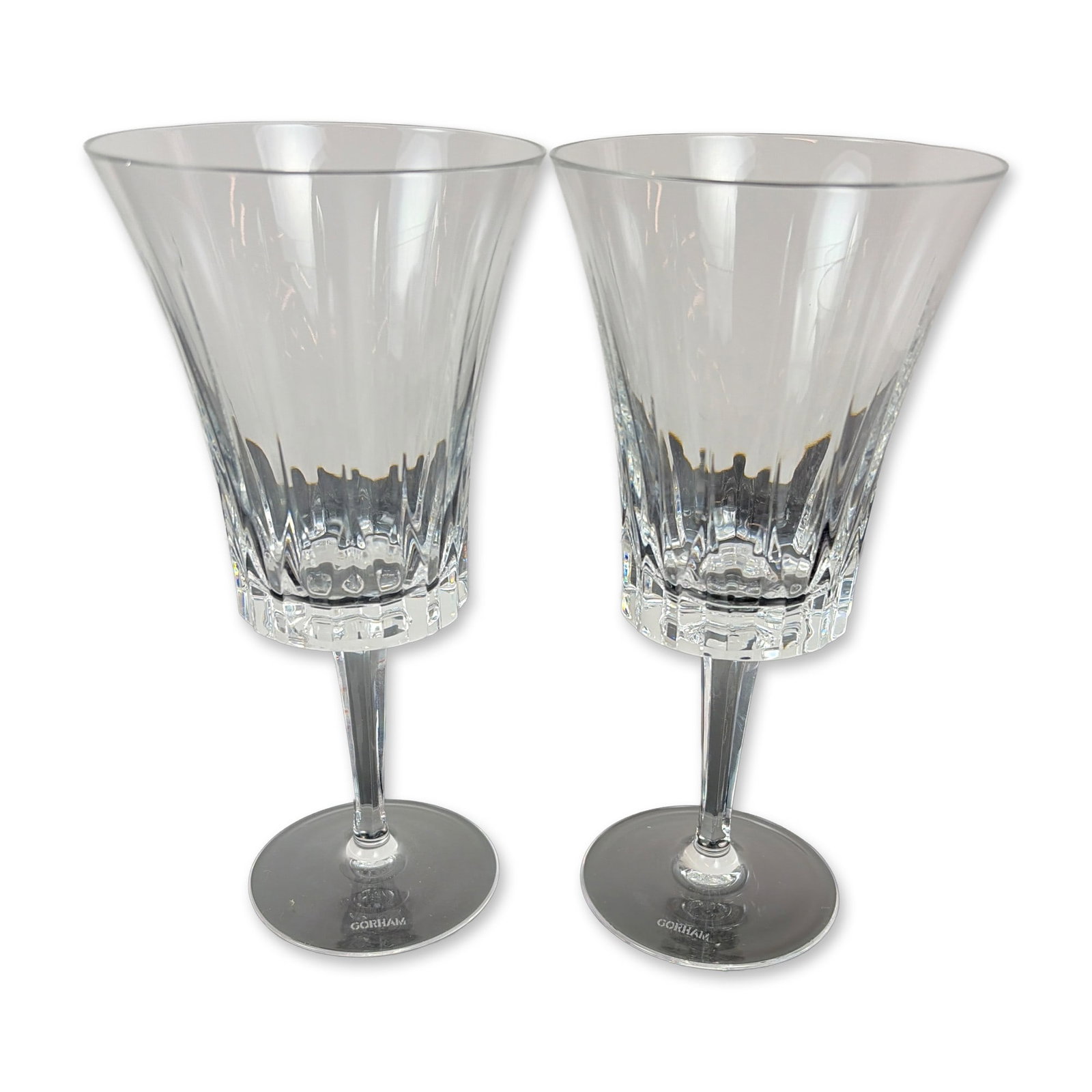 Pair of Gorham Richelieu-Rondo Crystal Water Goblet: Pair of stemmed glasses in Richelieu-Rondo pattern lead crystal, featuring flared bowls with vertical flute cuts and faceted lower sections above multi-faceted stems. Each etched GORHAM to underside o