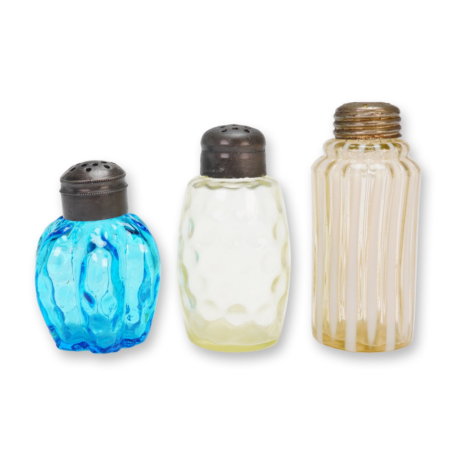 Three Early American Pressed Glass Shakers, Victorian Era: A trio of early American pressed glass shakers, 3pc. The collection includes three distinct forms and color palettes, consistent with late Victorian or early 20th-century manufacture. The first is a