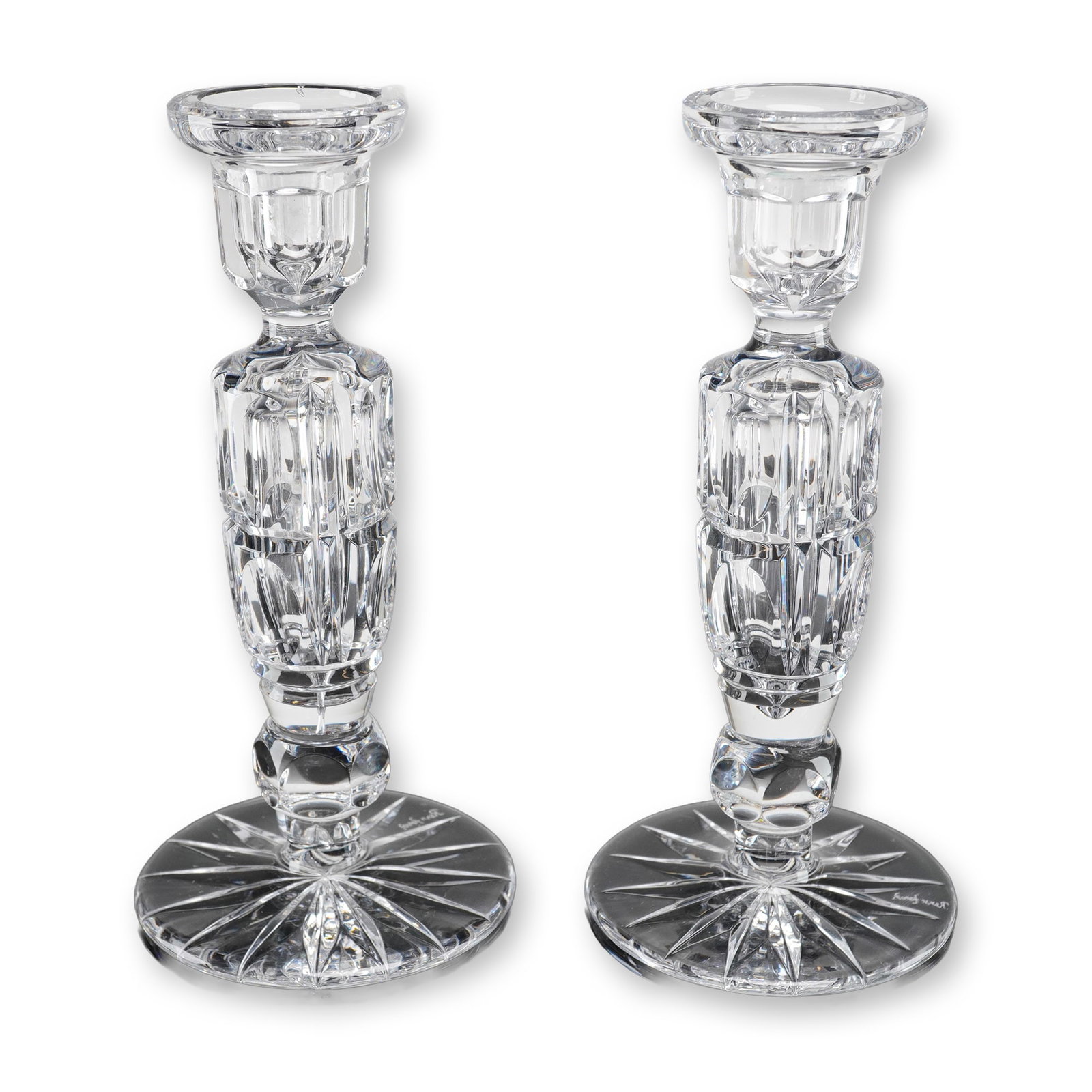 A Pair of REXX Full Lead Hand Cut Cameo Crystal Candlesticks: A pair of full lead crystal candle holders attributed to REXX, consistent with the Cameo Cut pattern and the Rexx Foral line. Each candlestick features a columnar stem with deep vertical faceting and