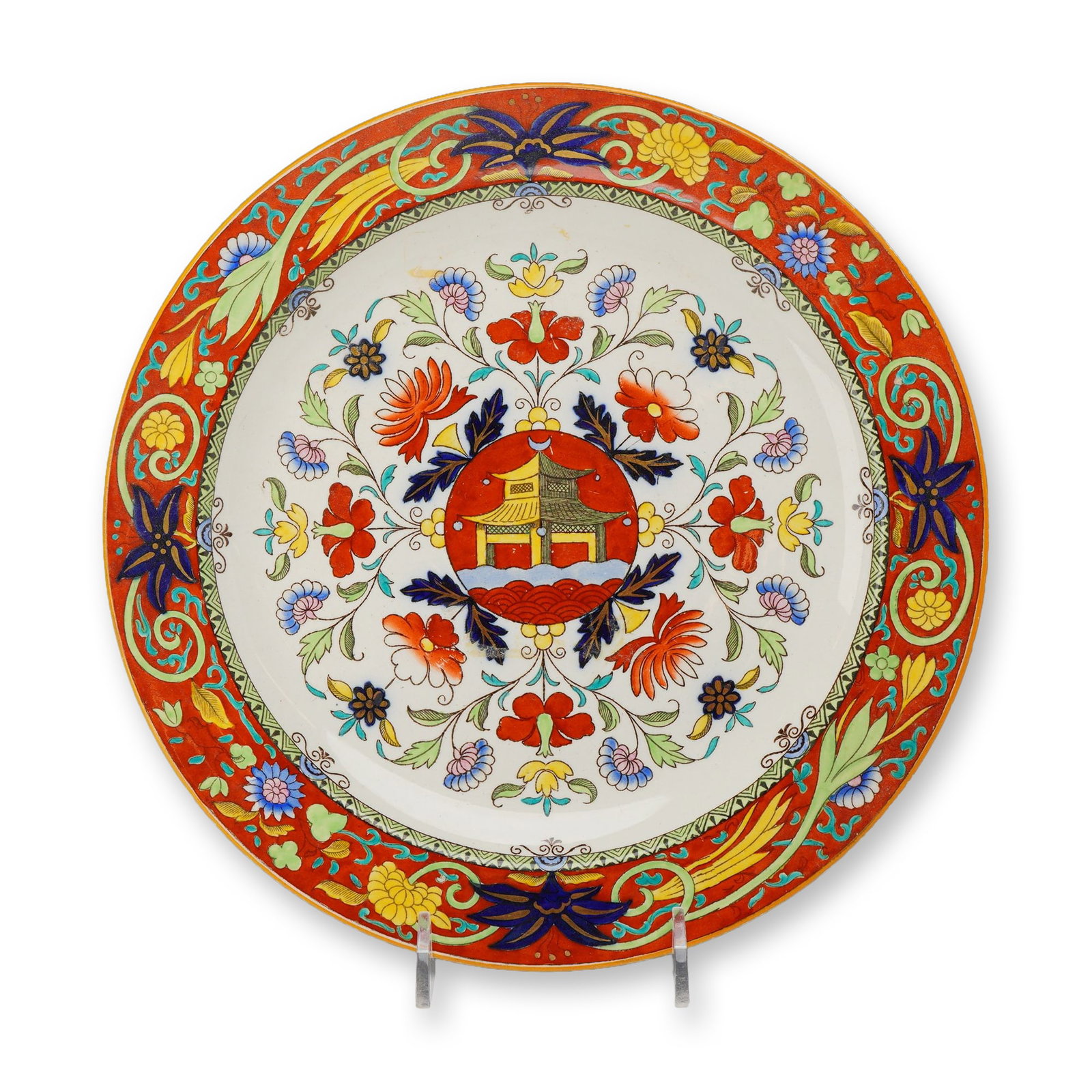 Wedgwood Pagoda Pattern Earthenware Plate, circa 1878: A late nineteenth-century Wedgwood earthenware plate decorated in the Pagoda pattern. The design features a central medallion depicting a stylized pagoda before a vibrant red sun, set against a cream-