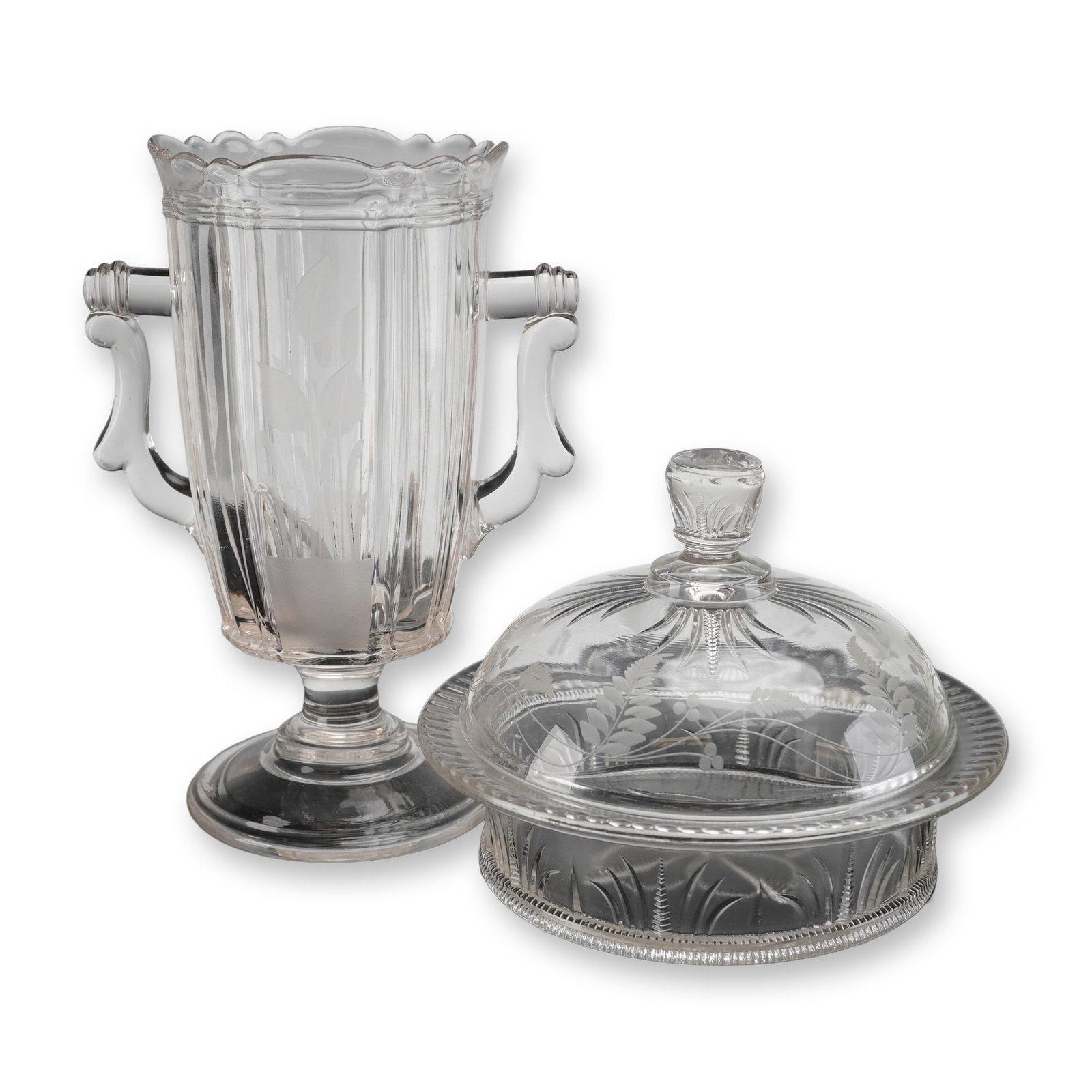 2pc Bryce Higbee Paneled Vase and Covered Dish: The handled vase is footed with a ribbed body, heavy molded handles, and a scalloped rim, featuring frosted stylized leaf motifs on the front panel. The covered round dish comprises a base with molded