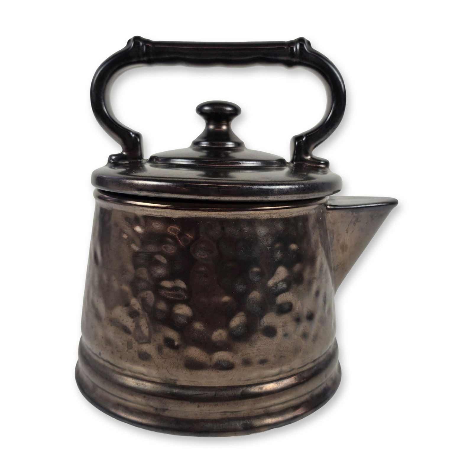 McCoy Ceramic Hammered Pewter-Tone Pitcher: The vessel features a tapering body with a flared base and an angular spout, characterized by a hammered-dimple texture. Constructed from dark pewter-like glaze. The detachable lid includes an