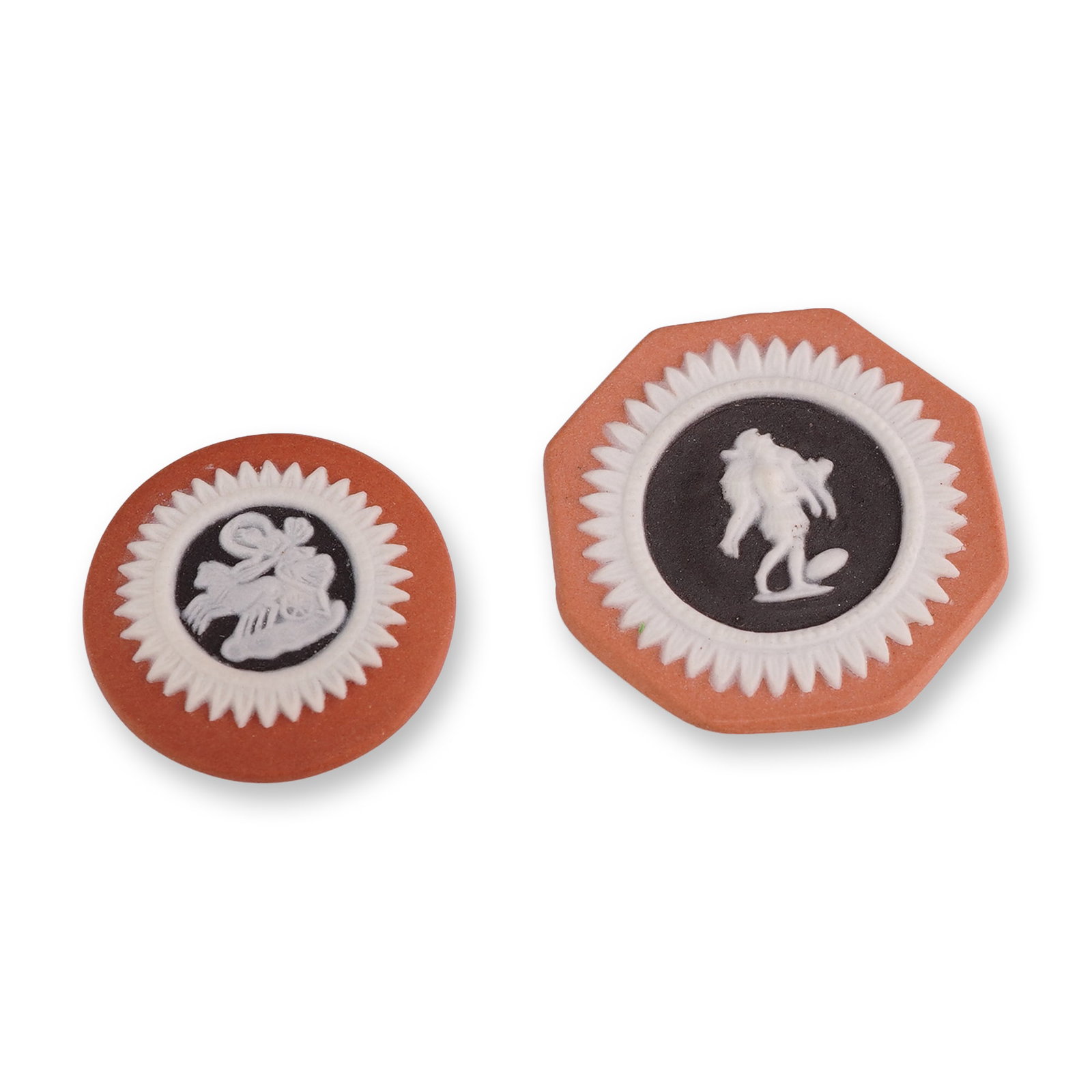 Pair of Wedgwood Tri-Color Jasperware Medallions: Wedgwood. Pair of miniature cameo medallions in tri-color jasperware stoneware, featuring a terracotta-colored body with black jasper dip centers and white relief decoration. The circular medallion