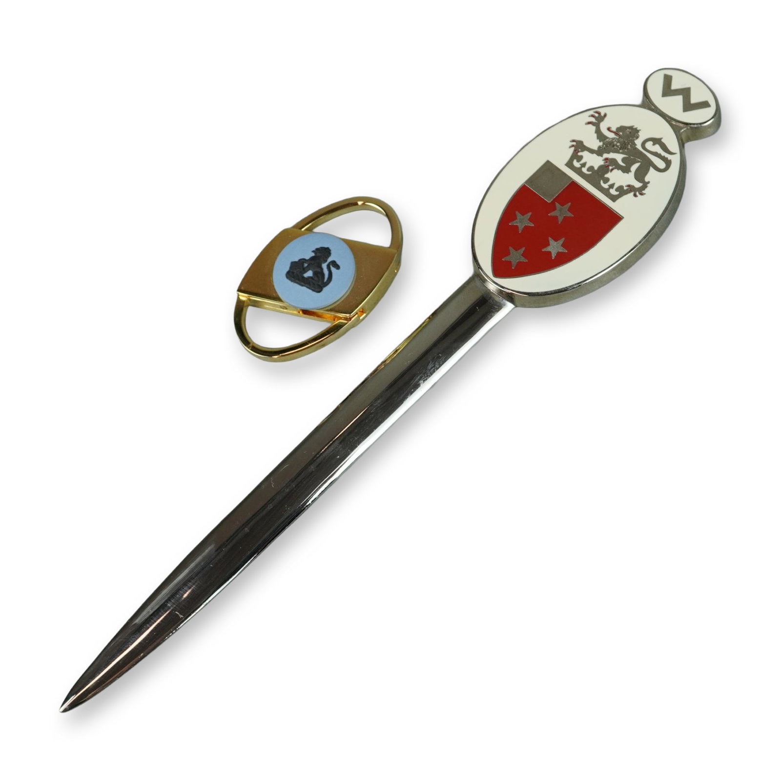 2pc Desk and Personal Accessories Including an Enameled Heraldic Letter Opener and a C.R. Rubin: This lot comprises two items. The first is a heraldic-themed letter opener featuring a polished metal blade with a tapered profile and pointed tip. The handle is an oval medallion with inset enamel de