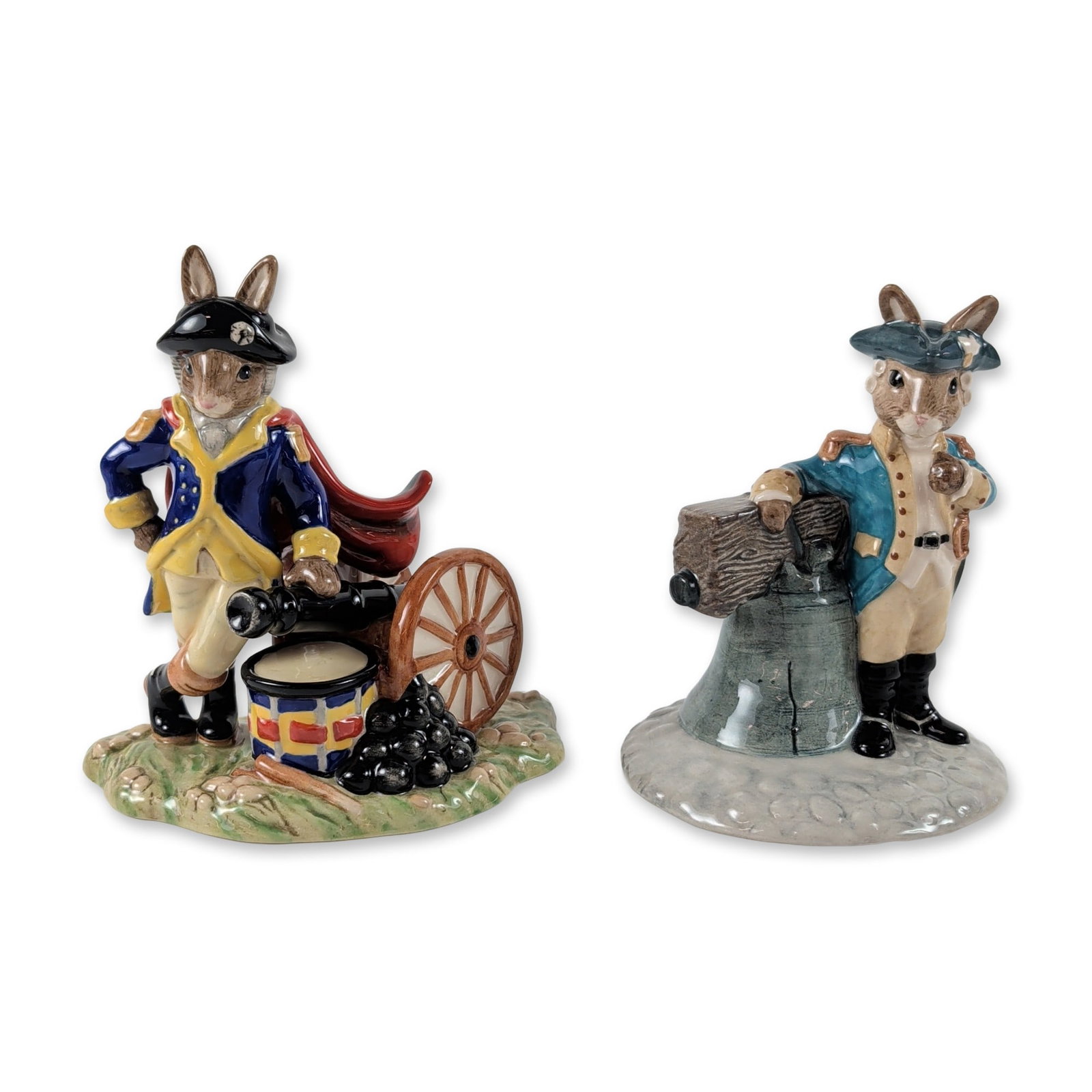 2pc Royal Doulton Bunnykins Ceramic Figurines: Royal Doulton Bunnykins glazed ceramic figurines, featuring American historical subjects. The group includes Liberty Bell (DB 257) and George Washington (DB 367) from the American Heritage Collection.