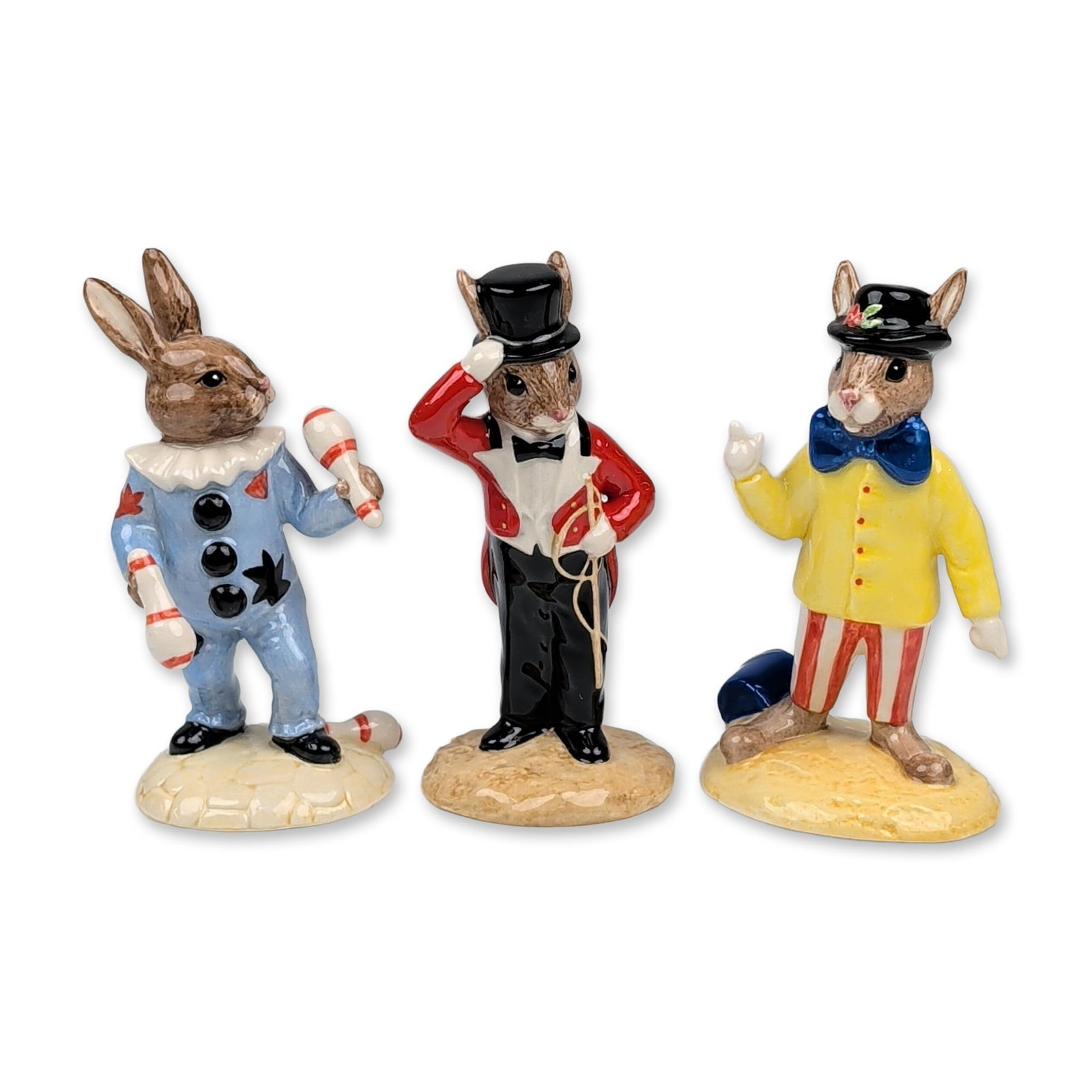 Three Royal Doulton Bunnykins Circus Figurines: Royal Doulton. Three limited edition Bunnykins figurines in glazed bone china from the circus collection. The group includes Joker (DB171) wearing a yellow jacket and red and white striped trousers, R