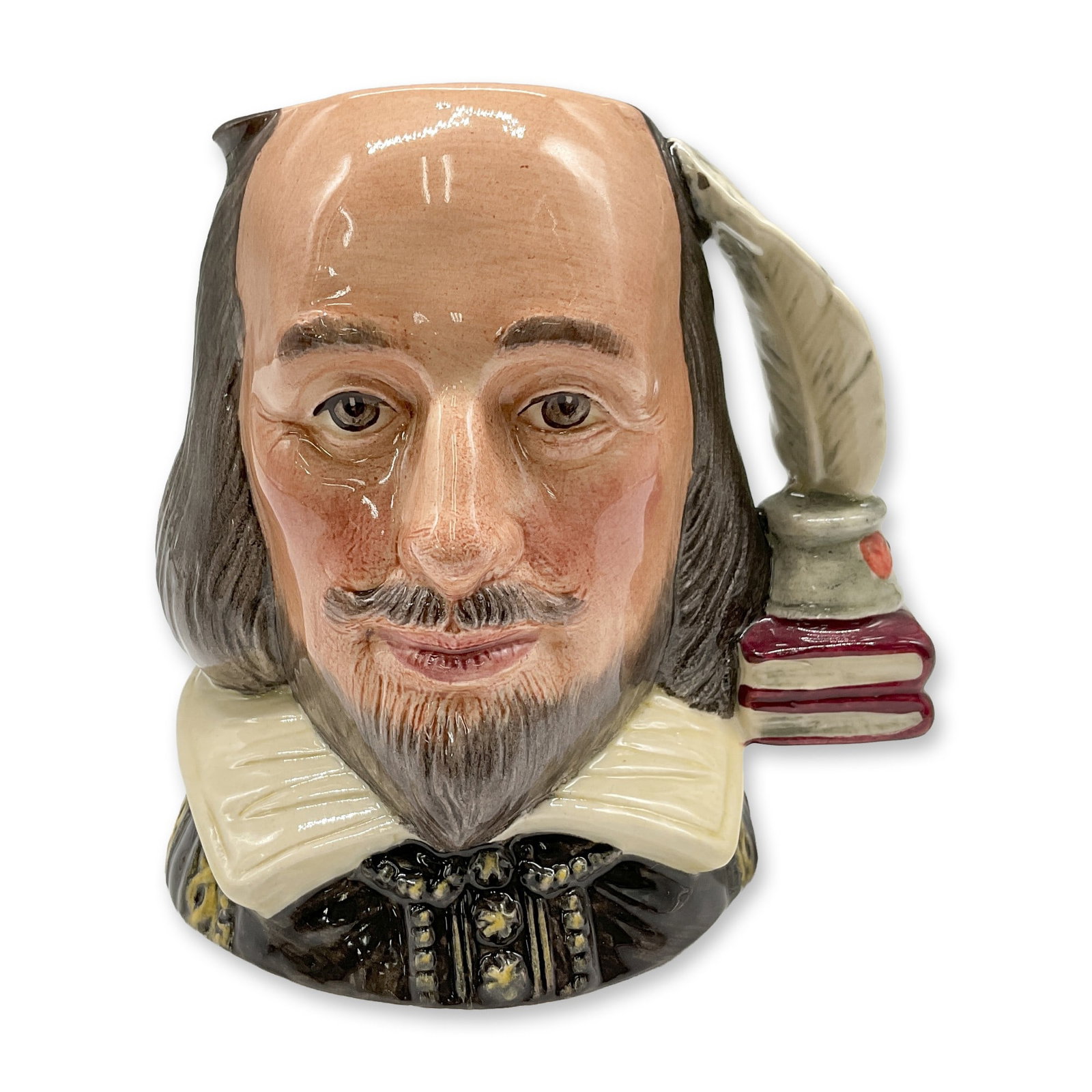 Shakespeare D6938 - Small - Royal Doulton Character Jug: Black coat; yellow collar; light brown hair and beard; burgundy books; grey inkwell and quill. Royal Doulton backstamp. Artist: William K. Harper Dimensions: 3.5"H Date or Era: 1993 - 2002 Manufacture