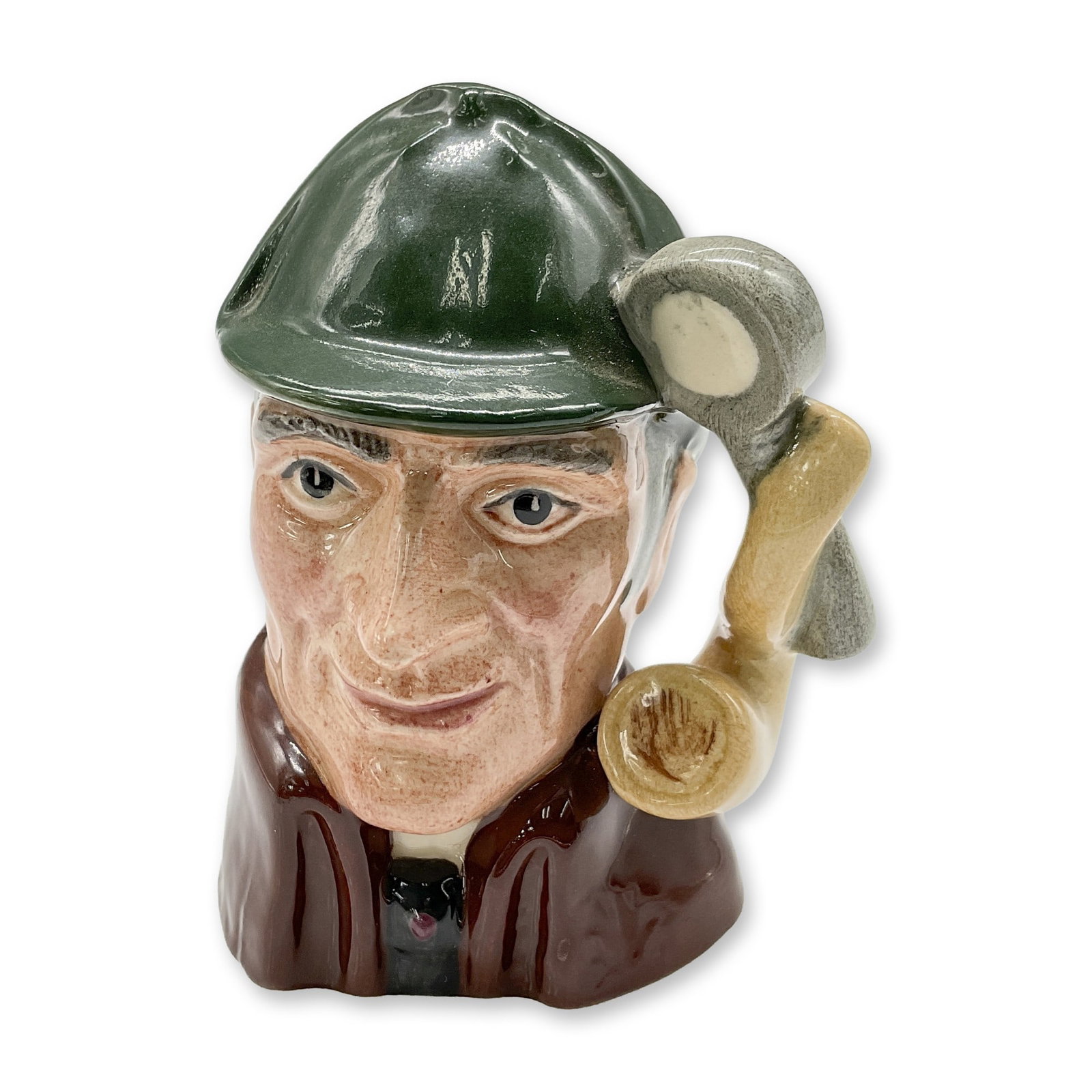 Sleuth D6639 - Mini - Royal Doulton Character Jug: Variation One, dark green deerstalker hat; brown cloak. Royal Doulton backstamp. Artist: Alan Moore Dimensions: 2.75"H Date or Era: 1973 - 1991 Manufacturer or Brand: Royal Doulton Country of Orig