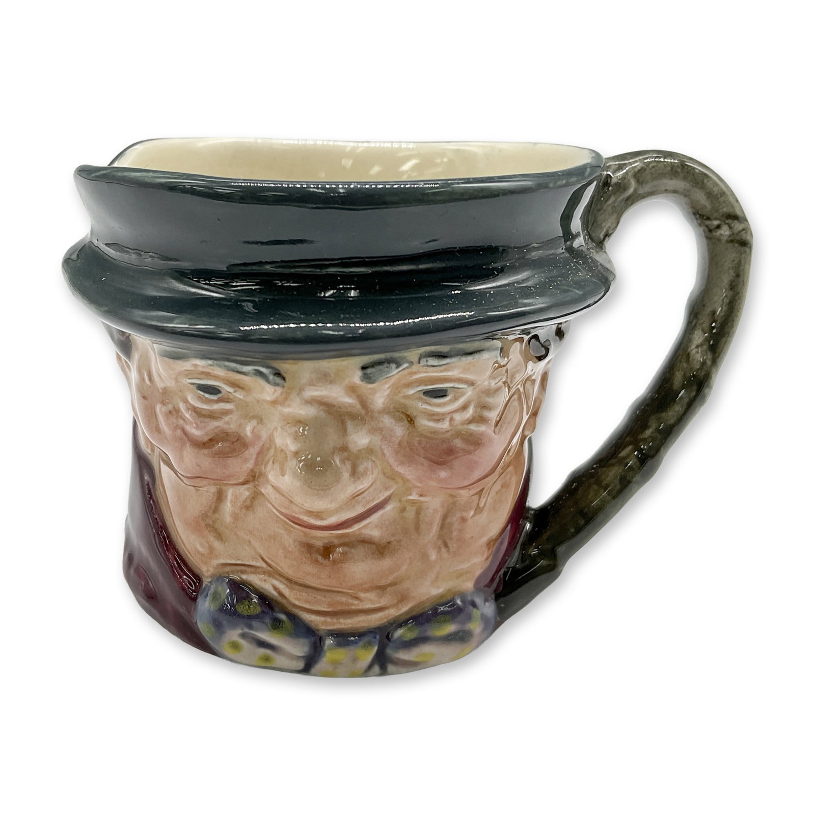 Tony Weller D6044 - Mini - Royal Doulton Character Jug: Dark grey hat; maroon coat; grey-white bow with yellow spots. Royal Doulton backstamp. Artist: Leslie Harradine and Harry Fenton Dimensions: 2.25"H Date or Era: 1939 - 1960 Manufacturer or Brand: Roya
